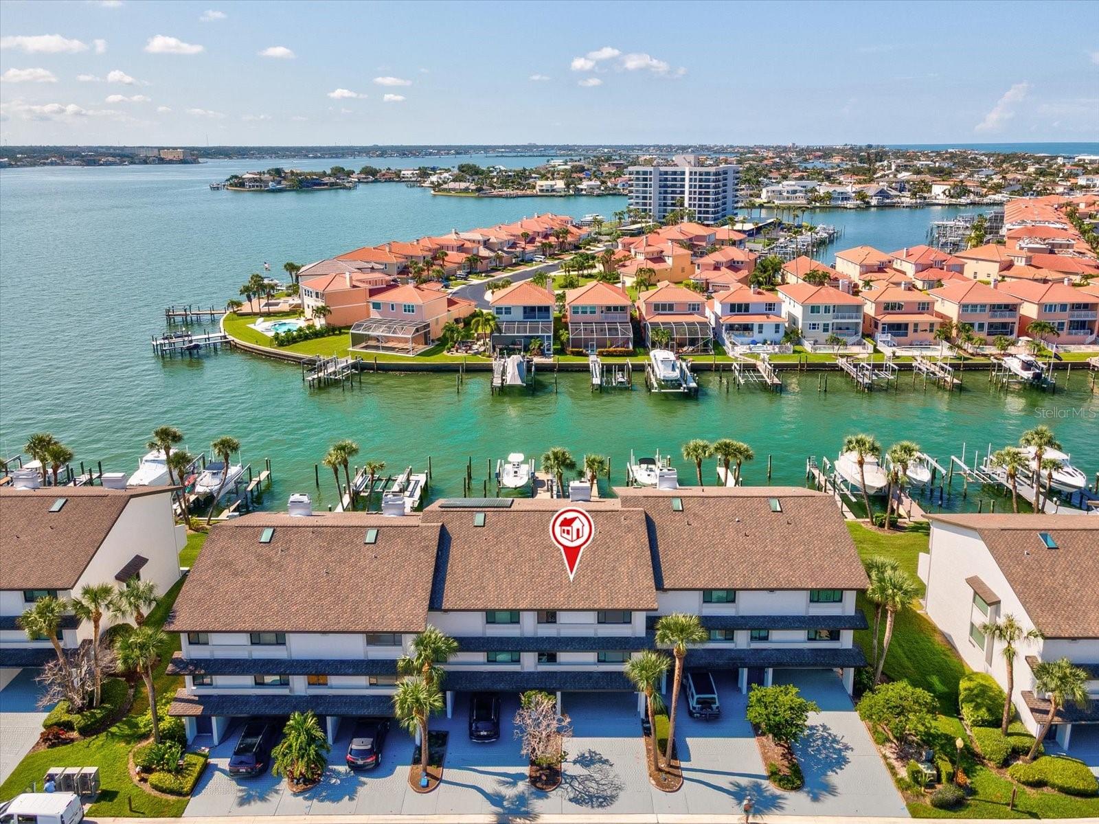This stunning residence feels like new construction, offering luxury living in the highly sought-after Sand Key Beach community. Now featuring 4 bedrooms plus a finished lower level, this home blends impeccable design with everyday functionality. Inside, every detail has been reimagined with top-tier finishes. Recessed LED lighting, solid wood doors and trim, and wide plank French White Oak flooring throughout. The open-concept living area connects a showstopping kitchen, custom shaker cabinetry, quartzite countertops, island, and premium JenAir appliances, with a light-filled dining space and balcony overlooking the water. Upstairs, the spacious primary suite is a true retreat, complete with a spa-inspired bath featuring a freestanding tub, glass walk-in shower, and mesmerizing water views. Three additional bedrooms and baths provide comfort for family or guests. The finished lower level offers endless versatility, perfect for a lounge, gym, or executive office with sliding doors leading to a private patio. A 4-ton AC system with UV light, high-impact windows and doors, and solid craftsmanship ensure peace of mind. Boaters will love the deeded dock with boat lift, providing quick access to Clearwater Harbor, the Intracoastal, and the Gulf of Mexico. Marina Del Rey residents also enjoy a heated saltwater pool and a location just steps from the sugar sands of Sand Key Beach.
This is waterfront living at its best.
