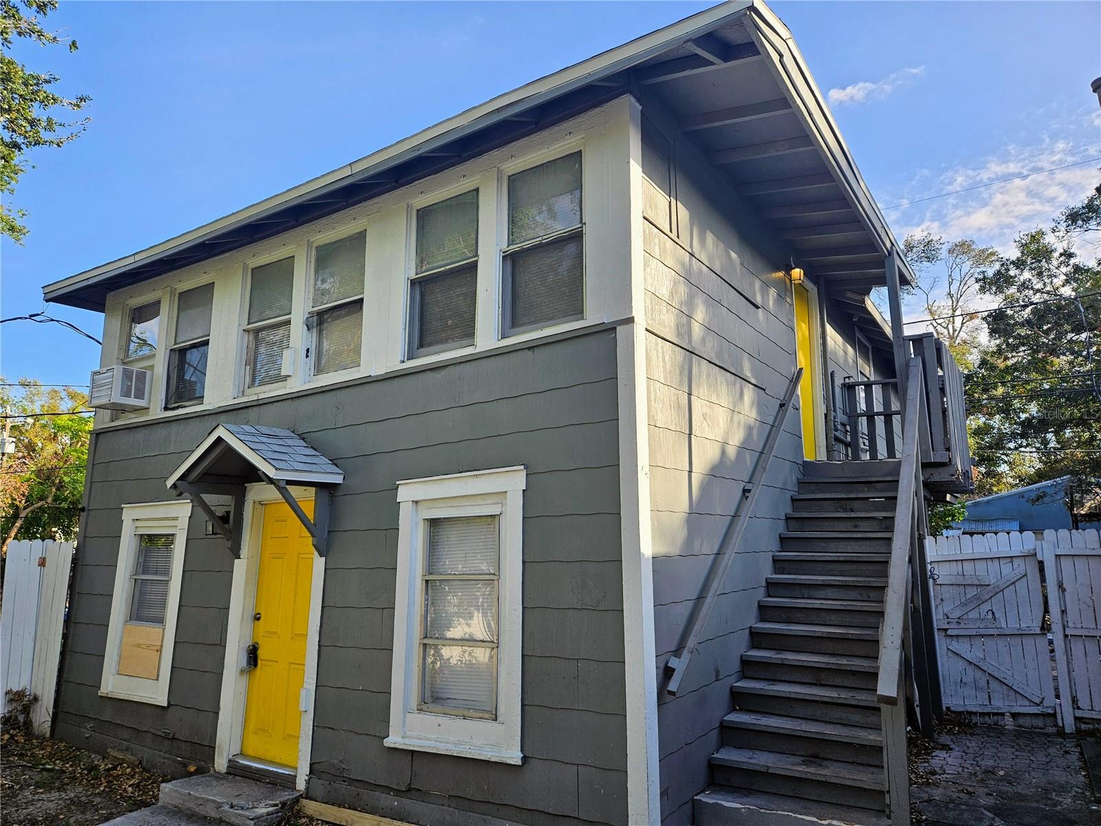 Very nice second-floor unit in a charming small 5-unit complex available for immediate Annual Lease. This property boasts beautiful new laminate flooring throughout. Step into a welcoming formal living room area with plenty of windows and bright light. The kitchen features new cabinets and counters as well as a full size refrigerator and stove / oven. The 2 bedrooms offer plenty of space with each having a large closet. The Bathroom has a nice tub shower combination. Extra storage with oversized linen closet. Wonderful shared common area between the buildings has plenty of shade and is an ideal spot to sit and relax or grill out with your friends and family. Convenient shared Laundry Room with washer and dryer on-site. Close to many amenities and public bus stop. Only minutes away from trendy Downtown St Pete. $65 Application Fee per adult. $100 Processing Fee. Owner will consider small pet with additional $250 Pet Deposit.