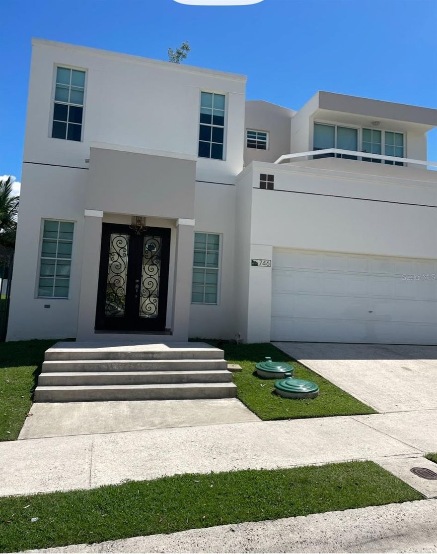 Two-Story home featuring 4 bedrooms, 2.5 bathrooms, remodeled kitchen, and spacious backyard. This property is fully equipped with confort and utility upgrades including  an automatic transfer switch generator, water cistern, solar water heater and softening system. Located in a gated community with 24/7 security this residence provides access to full range of resort-style amenities such a swimming pool, fully equipped gym, tenis courts, basketball court, volleyball court and a playground.This property is perfect for a families seeking ample space, confort, and an active lifestyle within a safe and vibrant neighborhood.