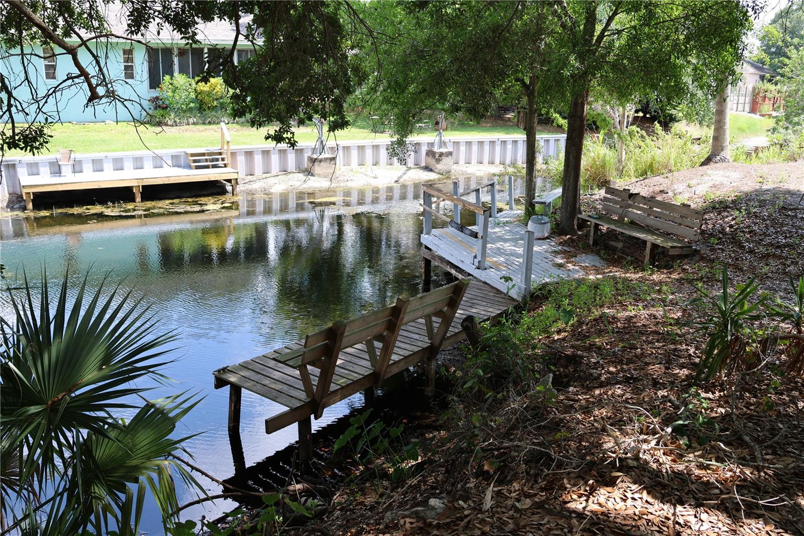 Oh, the possibilities! Enjoy this great, waterfront commercial location. This 4.0+/- acre gem, including the additional parcel #262901663500000160. It offers waterfront access and is ideally situated just a mile or so from Legoland Florida. Located approximately 1 to 1.5 hours from Tampa and Orlando International Airports and popular beaches, this versatile property combines commercial potential with natural beauty. Situated along Cypress Gardens Road and includes a clear water canal leading to Lake Dexter. The shaded parcel is adorned with mature oak trees, bringing nature to your doorstep. Enjoy direct access to Lake Dexter, a pristine 146-acre private lake in Winter Haven, Florida, making this property suitable for various investors, from dream homes to small businesses or Airbnb rentals. Imagine the possibilities: a serene canal-front residence paired with a thriving business just off Cypress Gardens Road, all in one location! Experience the best of both worlds with this unique property, offering commercial frontage and tranquil waterfront living. Note that all land use is subject to approval by Polk County, and potential buyers should verify permitted uses before purchase. Don't miss this opportunity to invest in a truly versatile piece of Florida real estate that combines commercial potential with natural beauty and waterfront access!