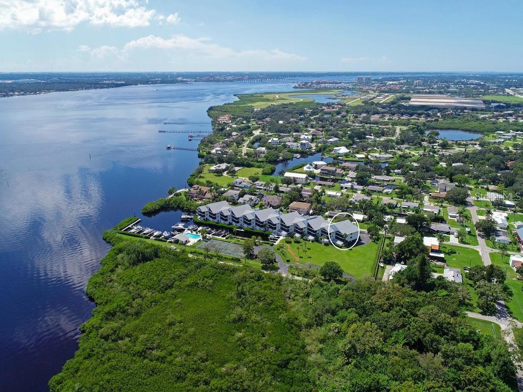 BOATERS! This is the place you have been looking for! Peaceful, quiet and when you want to go boating just walk down to your boat. I expect you will throughly enjoy the boating and the condo. Do you need a place for your BOAT and a 2 bedroom/2 bathroom End Unit Condo to go with it? This is the ideal location for you. Water Property on canal to Manatee River! Water and Electric at Boat Slip. Screened lanai spans across the back of the Condo which also includes a storage closet at the end. Assigned storage unit near your 2 under building parking spots. NO POPCORN CEILING, it's gone! Vertical blinds in Main Bedroom and Living Room Dec. 2022, and Refrigerator 2020, Kitchen, Guest Bedroom and Dining Area Blinds 2020, HVAC System with Ultra Violet Light-2020, freshly painted living-dining and Main bedroom July 2025. 3 new ceiling fans with lights July 2025. New light fixture in dining area July 2025. Once you exit the Marina on your boat there is convenient access up the Manatee River or out to the Gulf. This Old Florida charm community makes this a great place to be. River Place Community includes marina, pool house, pool bathrooms, a place to clean the catch of the day, kayak and canoe storage, outdoor grills, tennis court and gated on West side of complex. Can't help but love it here. Can be leased annually and NO need to wait a year or more to lease. Indoor Pest Service every other month and Outdoor Pest Service every other month by Association. Condo location is only approximately 1 mile from I75 at Exit 224 which is the Ellenton Outlet Mall Exit and 275 North is Exit 228. Approximate miles to 5 Airports! -Tampa airport is 44.4 miles, St. Pete airport is 38.8 miles, Sarasota airport is only 13.2, Punta Gorda airport is 65.8 miles and Ft. Myers airport is 100 miles! Great location. Downtown Tampa to the Amalie Arena is approximately 42.2 miles. UTC Mall is Exit 213 and downtown Sarasota is approximately 22 miles, so much to do in Sarasota , Bradenton and Tampa. Jump on your boat and pick a beach to go to or head out to Egmont Key or find that premium fishing spot. Sports enthusiasts-You can water ski, tube, wake board or go out to the Gulf for some Scuba Diving, snorkeling or fishing. Gulf Sunsets are spectacular.