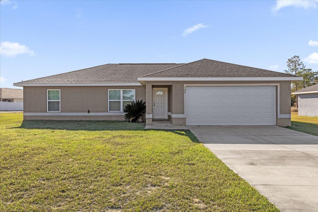 Photo of 162 Malauka Run, Ocklawaha, FL 32179 (MLS # O6385685)