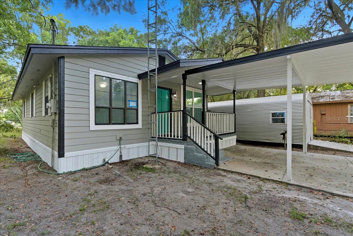 Welcome home! This fully remodeled, turnkey 3-bedroom, 2-bath home in Hawthorne offers modern finishes with fresh paint throughout and no carpet! Updates include a new roof, new water heater, welcoming front and side porches, and it's partially fenced! A sturdy metal-roof carport protects your vehicles, and the large shed provides ample storage or space for a workshop or retreat. With no HOA and a convenient location near Gainesville’s shopping, dining, and outdoor recreation, this freshly renovated property is completely move-in ready.