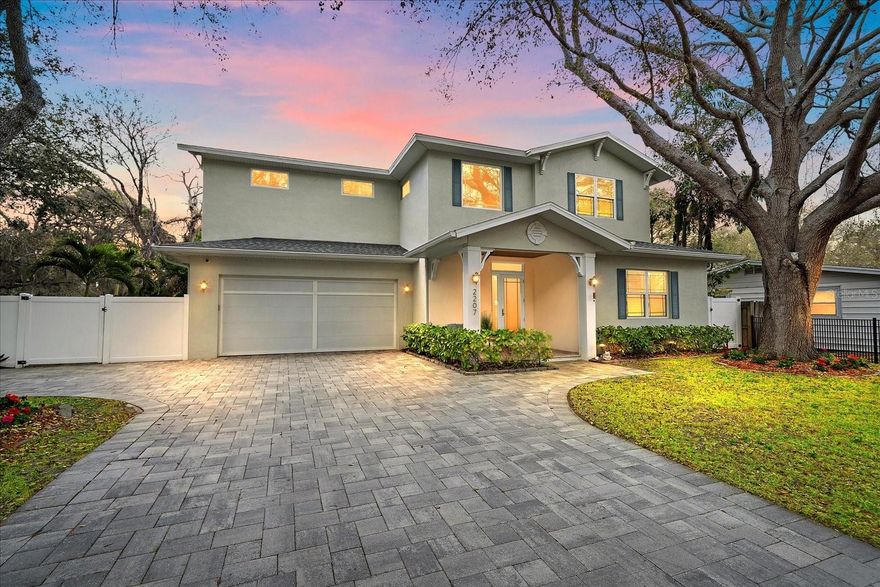 Located East of the Trail within the city limits of Sarasota, this custom-built 2017 Voigt Brothers pool home offers 3,120 square feet of living space on an oversized, gated, and fully fenced lot in one of Sarasota’s most sought-after residential neighborhoods. Just minutes to Siesta Key Beach, Lido Key Beach, downtown Sarasota, and Southside Village, this central Sarasota location offers privacy, convenience, and long-term value. Being located within Sarasota city limits also provides potential short-term rental flexibility, subject to current city regulations and buyer verification. Positioned in Flood Zone X and built with concrete block construction, the home offers durability and added peace of mind. Designed with a functional open floor plan, the home features high ceilings, abundant natural light, and seamless indoor-outdoor living. The living room is anchored by a modern electric fireplace, creating a warm focal point for the main gathering space. Automatic blinds at the front door provide added privacy and convenience. A three-panel sliding glass door connects the main living area to the covered lanai and screened pool, a highly desirable feature in Sarasota pool homes. The kitchen is equipped with Quartz countertops, stainless steel appliances, gas range, large center island, and newly installed refrigerator, microwave, and wine refrigerator in 2025. The primary bedroom is located on the first floor and serves as a private owner’s retreat with two walk-in closets and a spacious bath featuring marble flooring, soaking tub, walk-in shower, and dual vanities. A dedicated first-floor laundry room adds everyday convenience. Upstairs, engineered hardwood flooring has replaced previous carpet throughout the staircase and second level. The second floor includes a large bonus room ideal for a media room, home office, or gym. Two secondary bedrooms share a bath on one side, while a second primary suite with ensuite bath and walk-in closet is positioned privately on the opposite side, creating a desirable double-primary layout suitable for guests, multigenerational living, or flexible use. Outdoor living is designed for entertaining, featuring a screened lanai, paver pool deck, covered terrace, and fully equipped outdoor kitchen adjacent to the pool area. A newly added pool handrail enhances accessibility, and the fully fenced side yard provides usable green space for pets or recreation. The garage features epoxy-coated flooring for a clean, finished appearance. Recent improvements include fresh interior paint, professional cleaning, power washing, gutter maintenance, and refreshed landscaping, making the home move-in ready.
Additional features include hurricane impact-rated windows and doors, spray foam insulation, gas tankless water heater, LED lighting, and solid concrete block construction for energy efficiency and storm protection. Zoned for Southside Elementary, Sarasota Middle School, and Sarasota High School, this East of the Trail Sarasota home offers a flexible double-primary floor plan, outdoor kitchen, pool, and proximity to beaches and downtown in one of the city’s most desirable residential areas.