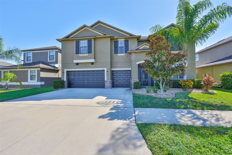 Step into luxury and space with this remarkable 7-bedroom, 4-bath, 3-car garage home offering 4,086 square feet of beautifully designed living. NEW ROOF 10/24. From the moment you enter, the inviting foyer and formal living and dining rooms framed with crown molding, set the tone for elegance and comfort. At the heart of the home, an expansive open-concept great room seamlessly blends the oversized kitchen, complete with center island, granite countertops, and abundant cabinetry, with the main living area (ceramic wood look tile), creating the perfect backdrop for family gatherings or entertaining. Just beyond, a private first-floor guest suite with ensuite bath doubles as an ideal in-law retreat. A versatile bonus room off the living area offers endless options for a den, office, or playroom. Upstairs, the primary suite is a true retreat, with room for king-sized furnishings, dual walk-in closets, and a spa-like ensuite featuring dual sinks and a walk-in shower. Five additional bedrooms and two full baths provide incredible flexibility, perfect for guest rooms, a theater, home office, library, or hobby spaces. Outdoors, the oversized screened lanai is an entertainer's dream, complete with hot tub, fire pit, and covered lounging area, all overlooking a tranquil pond setting. With thoughtful upgrades, expansive living spaces, and a prime location, this home is more than a place to live; it's the lifestyle you've been waiting for.