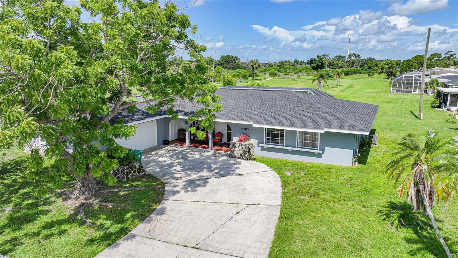 This beautifully updated 3-bedroom, 2-bath pool home is the perfect combination of style, comfort, and peace of mind designed for the Florida lifestyle you've been dreaming of! Set on a great street with a private backyard view of the former golf course greenbelt, this home offers extra privacy and no rear neighbors. And with Flood Zone X designation, that is a true bonus in Florida! Step inside and enjoy the open, inviting layout with luxury vinyl plank flooring throughout. The kitchen is fully updated with sleek quartz countertops (warranty transferable), new stainless appliances, and refreshed cabinetry ready for everything from casual coffee mornings to lively dinner parties. The flexible floorplan also includes an additional space that can serve as a den, home office, or even be sectioned off as a fourth bedroom, giving you the options and space to fit your lifestyle. Both bathrooms have been stylishly remodeled, featuring double sinks and modern tile showers, creating a spa-like feel for everyday living. The owner's suite is its own retreat, complete with dual walk-in closets and a thoughtfully designed bathroom, complete with two separate vanity spaces, including one positioned privately from the shower area for added convenience. Outside, the saltwater pool has been resurfaced (2022) and features an electric heater for year-round enjoyment. The indoor separate utility room currently serves as a dry bar, making entertaining poolside effortless. For your peace of mind, this home includes a 2023 roof, a 2018 electrical panel, an impact-rated garage door, and electric hurricane roll-down shutters. Location is key and this one is close to everything! Minutes from shopping, dining, golf, medical facilities, parks, and Port Charlotte's waterfront. Whether you're looking for a full-time residence or a winter getaway, this home makes it easy to embrace the Florida lifestyle.
2305 Beacon Dr. is more than just a home, it's your next chapter of relaxed, sunny living!