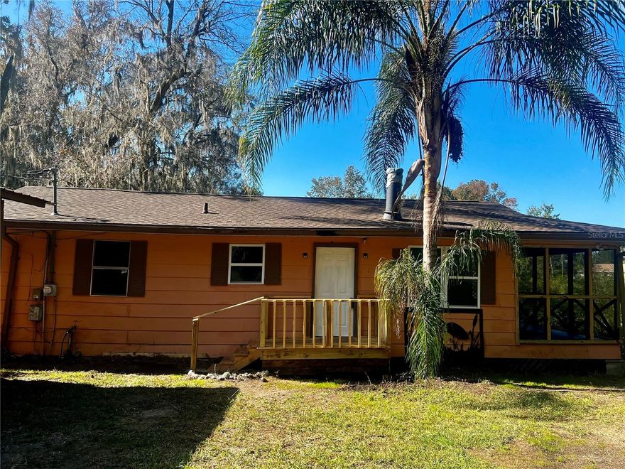 Welcome Home to your peaceful paradise on the shores of Lake Bryant. The lake is a navigable lake and offers the lifestyle most can only dream of.  Whether you are an outdoor enthusiast or simply enjoy the tranquility of waterfront living, You can enjoy boating & fishing right from your own back yard or wake up to the sun glistening on the water through the huge windows that overlook the lake or even maybe enjoy your morning coffee from the screened porch.  This home is a 3/2 with 1104sf-PROPERTY RECORDS SHOWS 2/2,  offers a serene natural setting with the perfect blend of comfort, tranquility, and waterfront beauty. Updates include new flooring & roof in 2023,  A/C 2020 AND...per seller-electrical has been updated.   Lake Bryant is approx. 850 acres offering is in the heart of the Ocala National Forest and offer some of the best fishing in Florida, with a variety of fish to catch including striper, large-mouth bass, cat-fish, bluegill and crappie. Come take a look and make this your year round home or your vacation retreat!    Lake Bryant RV resort, public boat launch and a cute little Tiki bar is just down the road.  Schedule your private showing today because this one shouldn't last long!