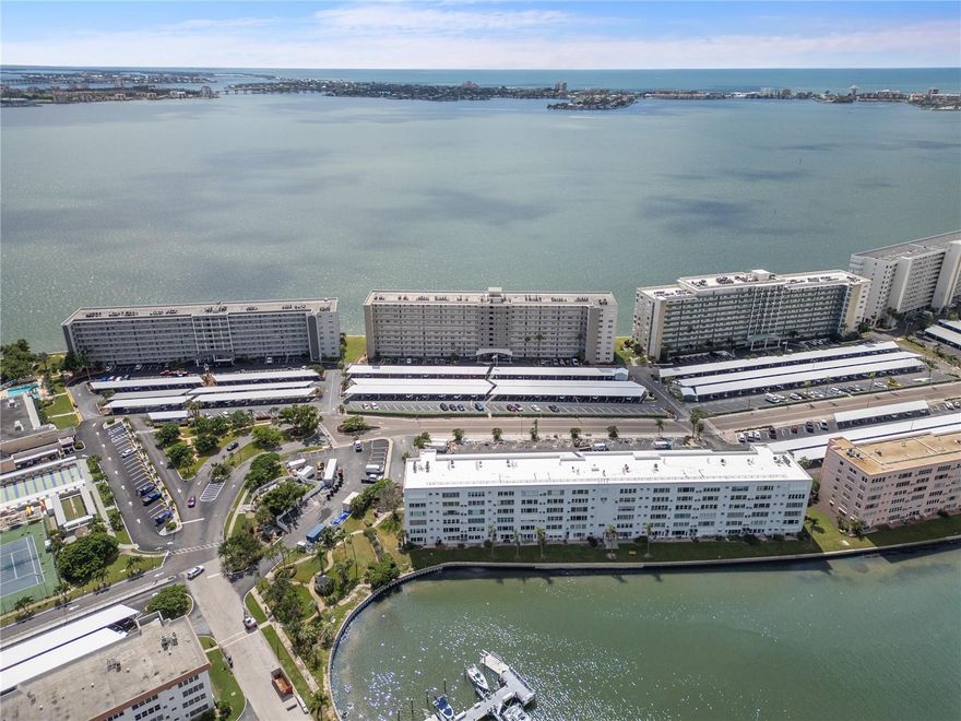 This second-floor, premium corner end-unit condo in sought after Town Shores is fully remodeled and waiting for its proud new owner. Overlooking green tropical landscaping and the community marina, it includes a new electrical panel (2021), all high end appliances (2021), and a matching air handler and condenser (2021) from the recent full remodel. Both bathrooms were redone with fully tiled showers and floors, and in-unit shut-off valves were added for convenience. The impact rated windows allow natural light from your unobstructed views to pour in this waterfront abode. Additional upgrades include a Nest thermostat, and an impact storm door installed in 2023. The condo comes partially furnished with a covered parking space. The Lancaster building itself has a brand-new roof completed in 2025, and has completed and passed the SIRS and Milestone inspections, offering peace of mind for years to come. The extra storage closet is on the 3rd floor just above. Step out on the town to downtown Gulfport’s waterfront, restaurants, and shops, and enjoy one of Pinellas County's last small-town areas. Positioned strategically within the community, the unit is a short walk from the community clubhouse and grill; also offered by Town Shores are Bocce courts, shuffle board, tennis, pickleball courts, 4 swimming pools, a library, poker room, billiards room, sauna, and fitness room. On-site property manager and maintenance manager. Kayak launch available for resident use as well! From the remodel to the newer appliances, brand-new roof, completed Milestone & SIRS, and every major item taken care of, there is nothing to want for here. This unit is a MUST see! Schedule your showing and embrace the ambience of your new home in Gulfport!