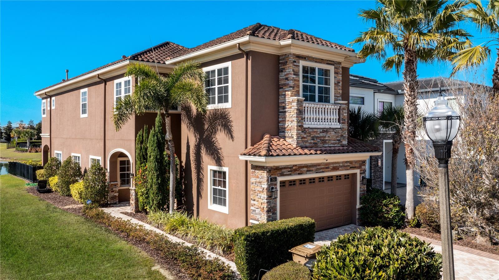 CUSTOM, FULLY FURNISHED former MODEL HOME with a west facing WATER VIEW. This amazing private pool home is walking distance to the Jack Nicklaus Clubhouse located on Reunion's West Side. The first level features ceramic tile throughout with tasteful detail. There are two extra sitting areas, a formal dining room & open living area with beautiful exposed wood ceiling beams. The kitchen is a chef's dream, that includes granite countertops, island & high end appliances. The Primary Suite includes a private balcony with an amazing water view. The oversized 4th bedroom is ensuite and has been converted into a billiard room. The pool & spa are almost new. Enjoy an afternoon BBQ with the outdoor kitchen, then sit back and relax under the covered lanai. Great opportunity to utilize as a primary residence, second home or vacation rental property. Reunion Resort is a 2,300 acre Private Golf & Tennis Community, just 6 miles from Disney and a short drive to the Orlando International Airport.