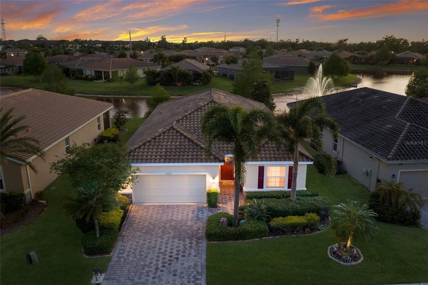 WELCOME to your slice of paradise in the sought after GATED community of Soleil West!!! This beautifully maintained one-story home offers 3 bedrooms, 2.5 baths, a 2-car garage, and 2,036 sq. ft. of thoughtfully designed living space. From the moment you walk through the front door, you’re greeted by a long, inviting hallway featuring a guest bedroom and a full bath with a tub/shower combo and single vanity, making it perfect for visitors. Just beyond, step through ELEGANT FRENCH GLASS DOORS into a versatile den, ideal for a home office or formal dining room. Continue into the heart of the home where an open-concept kitchen and living room create the perfect space for entertaining and everyday living. The SPACIOUS kitchen boasts upgraded cabinetry, a TILED backsplash, stainless steel appliances, WALK-IN PANTRY and a large island with a dual sink and eat-in space. Adjacent to the kitchen, the dining area is perfectly positioned with a window overlooking the lanai. The living room offers a warm and relaxing atmosphere, complete with glass sliders that open to SERENE pond views. Tucked away for maximum privacy, the primary suite features a TRAY ceiling, UPGRADED carpet, and an ENSUITE bath with dual sinks, a walk-in tiled glass shower, and a separate soaking tub. An additional bedroom and a convenient half bath complete the layout. Step outside to your screened-in lanai and your own PRIVATE retreat where you can unwind while enjoying breathtaking sunsets over the peaceful POND and fountain. The home is beautifully landscaped and includes PREMIUM LUXURY VINYL WOOD flooring, upgraded ceiling fans throughout, added cabinetry in the laundry room for extra storage, and a new HVAC blower motor installed in 2023. Residents of Soleil West enjoy gated access and resort-style amenities including a clubhouse, pool, fitness center, and dog park, all in a PRIME location just off University Parkway. You’re minutes from The Mall at University Town Center, Nathan Benderson Park, Sarasota-Bradenton International Airport, fine dining, shopping, top-rated schools and the WORLD FAMOUS GULF BEACHES. This is truly the home you’ve been waiting for, offering comfort, style, and an unbeatable location. Don't wait to make this your home and begin your FLORIDA Lifestyle!