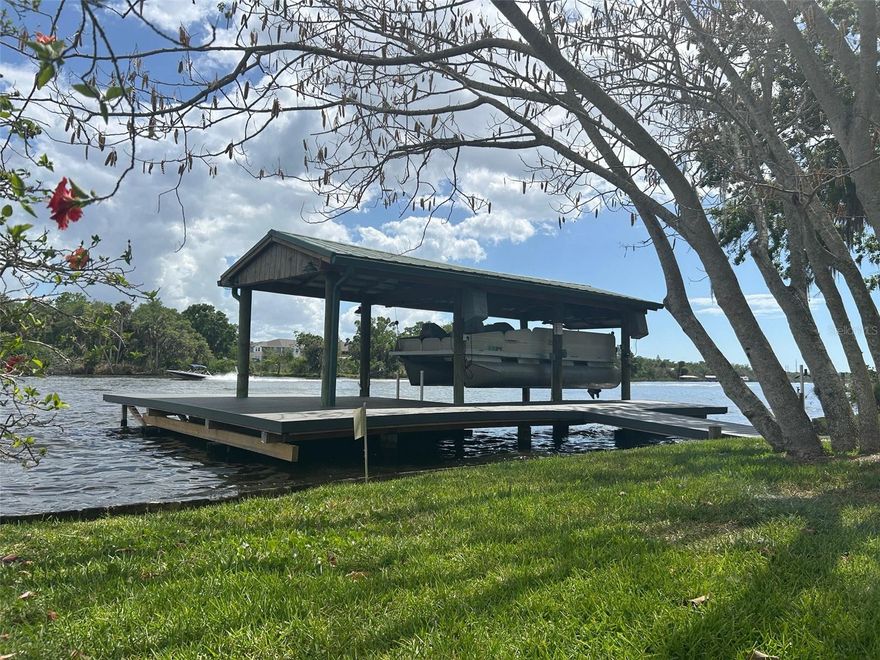 Alafia Riverfront home located on the north side of the river in Riverview, off Riverview Drive between Hwy 301 Bridge and I-75, in the wake zone, only 10 minutes to Tampa Bay. Large lot, 155 x 98, dock and covered boat lift. For your privacy, at the end of a dead-end street. This home is like new, immaculate, having a flexible floor plan. Also negotiable to be purchased furnished; the pontoon boat is also negotiable. One detached garage with storage space plus detached storage shed along with ample, paved parking area. Room dimensions to be verified. This is one of the Alafia jewels currently offered on the river. Immediate occupancy. More photos coming soon.