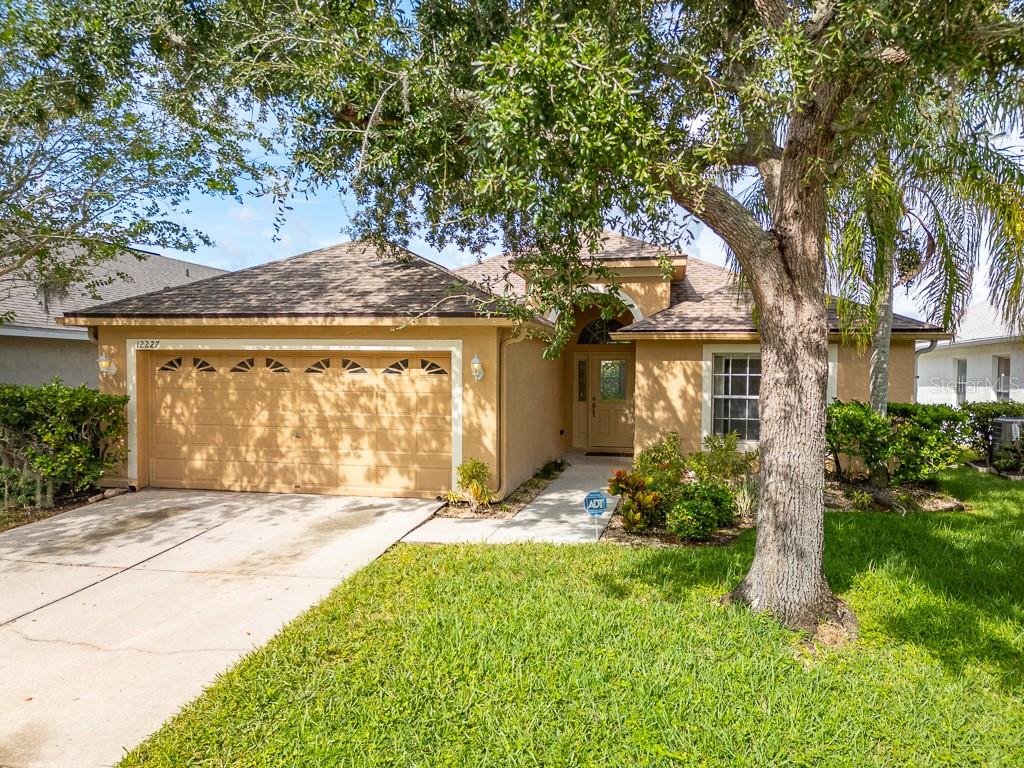 Stop Scrolling! This is the one! Best Value in Desirable exquisite Westchase being sold by the original owner! Welcome to 12227 Coldstream Lane, a rare opportunity in the highly sought-after gated Sheffield community of Westchase, one of Tampa’s most desirable places to live. This home has been lovingly maintained by the original owner and is a true blank canvas, ready for your personal touch. Step through the front door and you’re greeted by a bright, open living room with soaring ceilings and natural light that flows into the dining area and kitchen, perfect for entertaining or everyday comfort. Off of the Great room is a bonus space ideal flex space for a home office, media room, or play area. The primary suite is a private retreat, featuring an updated master bathroom with sleek modern finishes, granite countertops, step-in shower and jetted tub. 2 additional Bedrooms share an adjacent beautifully refreshed secondary bath. Outside, relax on the screened deck that overlooks a quiet backyard, offering endless possibilities for outdoor living. The epoxy-coated garage floor adds a polished, durable touch. Ideal for storage, hobbies, or a home gym. Sheffield is a private, gated enclave tucked in the heart of Westchase just minutes from major shopping, dining, top-rated schools, the Veterans Expressway, and Tampa International Airport. Enjoy the serenity of a quiet neighborhood while staying close to everything. Homes like this that are a true blank canvas with key updates already complete rarely come on the market. Don’t wait! This is the best value in Westchase and will not last long. Schedule your showing today and make it yours!
