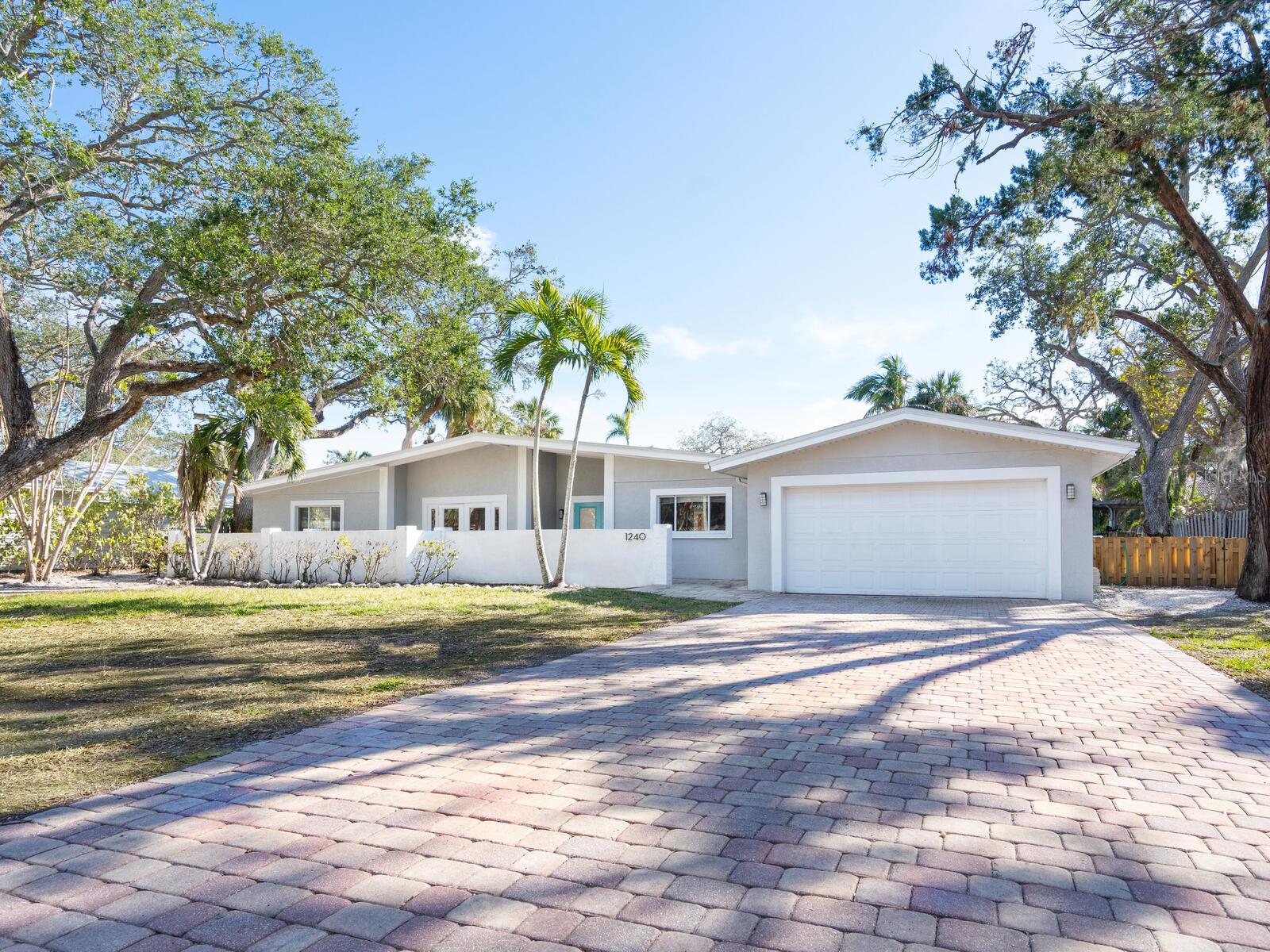 New Price! A rarely available property in Royal Palm Harbor, Siesta Key. Discover the ultimate island lifestyle just half a mile from the world-renowned, powdery white sands of Siesta Beach and the Gulf of Mexico. In a private, lush, tree-canopied community, this spacious three-bedroom, 3.5-bath, two-car garage home sits on a deep sailboat water bayou, just five lots from Sarasota Bay and the Intracoastal Waterway, offering direct gulf access with no fixed bridges. The nearly 18,000-square-foot lot provides endless possibilities to renovate or build your dream waterfront retreat. The home has been professionally remediated and features a sprawling layout that opens to breathtaking water views. French doors lead to a sparkling freeform pool, while the screened patio is surrounded by lush, tropical landscaping, the ideal setting to enjoy Florida’s stunning wildlife and serene sunsets. Boaters will love the 111 feet of seawall, offering plenty of space to dock a powerboat or sailboat. Whether you choose to launch a kayak, paddleboard or cast a fishing line from your backyard, this location is ideal for water enthusiasts. Ideally minutes from Siesta Village, you'll enjoy charming restaurants, boutique shopping and vibrant nightlife. Plus, downtown Sarasota’s arts and entertainment scene is just a short 15-minute drive away. This is a rare waterfront opportunity to create your ideal island getaway. Schedule your private tour today!
