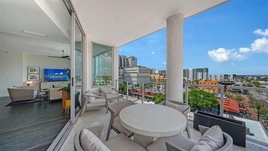 Welcome to The Mark, a contemporary residence in the heart of downtown Sarasota. This sixth-floor corner condominium spans 2,112 square feet of interior living space with an additional 170-square-foot terrace offering panoramic city views. The open-concept floor plan integrates the kitchen, dining and living areas, all framed by 10-foot ceilings, motorized shades, ceiling fans and custom porcelain tile flooring. The kitchen features an induction cooktop with hood, convection oven, microwave, tiled backsplash, RO drinking water system, French door refrigerator with ice and water dispenser, and a large island for entertaining. Each of the three bedrooms includes a private en-suite bath, with primary suite offering two closets (including a walk-in), a ceiling fan and a spa-inspired bath with dual vanities and a multi-head walk-in shower. A powder room, dedicated laundry room with full-size appliances and cabinetry, and a den designed for work or leisure complete the interior. This 2019-built residence includes Cat-5 impact windows, Cat-5 ethernet wiring throughout and a secured storage space on the same floor. One reserved parking space is on the third level of the secured garage. The building is outside a designated flood zone. Amenities at The Mark include a 60-foot resort-style pool with infinity edge, swim lane and full-length bench seating, a spa, two gas grills, gas firepit with lounge seating, fitness center with a spin/Pilates room, a clubroom with full bar, large TVs and pool table, a business center and conference room for resident use. Residents benefit from 24/7/365 front desk staff, secured lobby access and overnight roving security. Enjoy immediate access to Sarasota’s renowned restaurants, shopping, arts venues and the harbor. The Mark, where downtown is downstairs. Showings begin March 28, 2026, meanwhile, please refer to the virtual tour link.