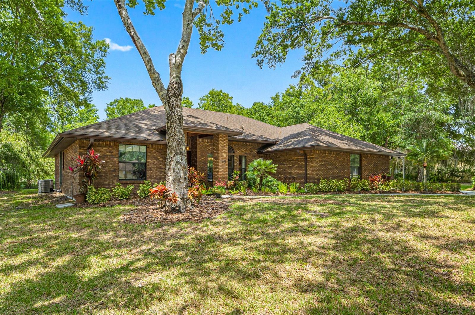 Welcome to 9206 65th Ave E, a serene retreat nestled on 1.31 acres in the heart of Braden Woods. This 3-bedroom, 2-bathroom home offers 2,115 square feet of inviting living space, where mature oak trees and wooded views create a private, park-like setting. Inside, you'll find a spacious kitchen, a cozy fireplace, and 2 flexible bonus rooms perfect for guests and a home office. Step outside to enjoy a heated, screen-enclosed pool and spa—ideal for year-round relaxation. With a low annual HOA fee and pet-friendly policies, this property blends comfort, charm, and convenience just minutes from Lakewood Ranch amenities, top-rated schools, and local parks. Whether you're hosting under the stars or unwinding in your personal sanctuary, this home delivers the lifestyle Florida buyers crave. Lanai Screens recently replaced, Garage floor freshly epoxied, septic tank replaced 2025. Roof 2019, A/C 2020.
