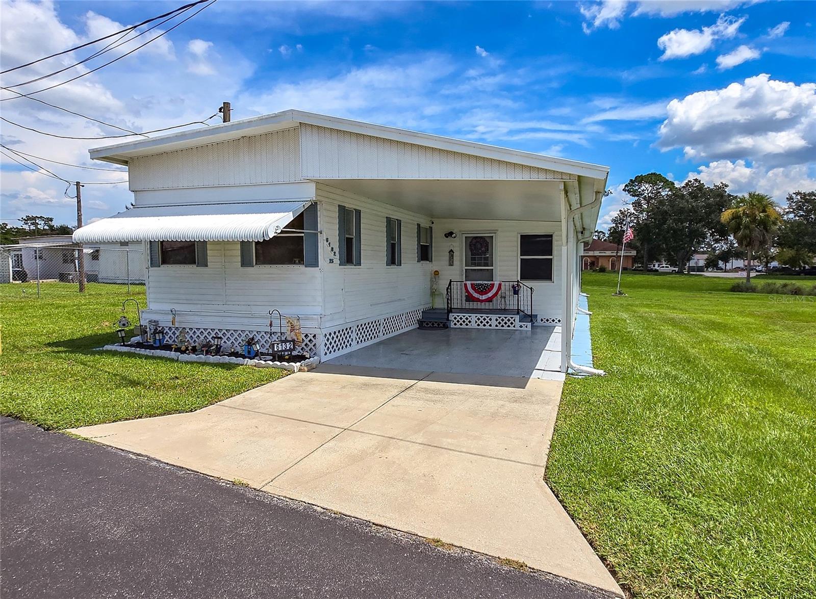 Welcome to your Florida paradise nestled in Pinecrest Mobile Home Park, a vibrant 55+ community in Zephyrhills. Come see this beautifully maintained 2-bedroom, 1-bath home. Most of the rooms have been freshly painted. Walk into the spacious bonus room which houses the washer, dryer and slop sink with a tiled floor. This room could used for many things. The kitchen has so many cabinets and lots of counter space with a breakfast bar, newer refrigerator, new sink and is open to the dining space and living room which is perfect for entertaining. Step out to the large screened enclosure at the back of the home, an ideal spot for relaxing and soaking up the Florida sunshine. It even includes a sizable storage shed for all your extras. The roof is around 6 years old an updated 200 amp electric panel. This home does have a ADT system if you would like to hook it up. Cement block all the way around the home with lovely flower beds.
New owner will be a shareholder in this wonderful community and have a low monthly HOA fee of $178 covering water, sewer, garbage, and lawn maintenance. You'll have peace of mind and more time to enjoy your new home. Located close to shopping, grocery stores, and an array of dining options, this home is perfectly situated for convenience and comfort. Don't wait—schedule your showing today this one will not disappoint!