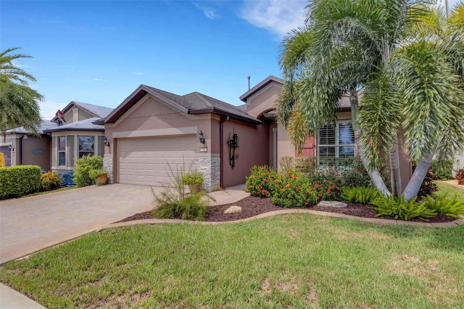 This 2 bedroom/2 bathroom Summerwood floor plan located in the 55+ neighborhood of DEL WEBB ORLANDO is a MUST SEE. This home is full of custom upgrades. Located on a beautifully landscaped lot complete with a widened driveway and concrete curbing, you enter the home through the glass front door equipped with a phantom screen. The gourmet kitchen features 48" cabinets with crown molding and pull-outs, granite countertops, backsplash, farmhouse sink, pantry with organization, and built-in Keurig coffee maker. The primary suite includes an oversized shower, granite countertops, upgraded toilet w/bidet, and walk-in closet with adjustable organization. The guest bedroom and bathroom, featuring a tiled shower, granite countertops and upgraded toilet and vent, are located in the front of the home. The office/den has been upgraded to include a custom Murphy bed and shelving and a barn door. The large laundry room includes cabinets and a utility sink. There is also a custom beverage station located off the laundry room. The garage with tandem space for golf cart parking and a 4' extension is AMAZING and has been updated with built-in cabinetry, tile flooring, fan and insulated garage door.
Enjoy the outdoors in the large screened lanai complete with a refrigerator and cabinet and pull-down blinds.
Additional upgrades include GENERAC whole-house natural gas generator, three SOLAR TUBES, whole-house water softener with filter, whole-house surge protector, NEST thermostat, RING doorbell, SMART sprinklers, porcelain tile throughout - NO CARPET, 8' doors, crown molding throughout, large baseboards, window casings, plantation shutters, HURRICANE shutter on the front window, upgraded ceiling fans and lighting and rounding corners. Also, both the interior and exterior of the home have been repainted.
The $425 semi-annual HOA fee provides 24x7 staffed security gate and master association-owned private road maintenance. Adjacent to recently renovated 18-hole White Heron Golf Club. The $277 monthly Del Webb HOA fee includes exclusive access to resident-owned 30,000+ SF Montecito clubhouse and amenities. DEL WEBB ORLANDO is a 55+ community with a tavern, indoor walking track, fitness center, indoor and outdoor pools and spas with locker rooms and showers, billiards, ping pong, craft room, and a ballroom for special events. Outdoor activities include pickleball, tennis, bocce, basketball, shuffleboard, community gardening center, an outdoor amphitheater, large brick fire pit and large screened-in gazebo over the water. Miles of biking and walking trails within Ridgewood Lakes gated community. Located conveniently to shopping at Posner Park (4 miles), Disney World, Universal Studios, Orlando & Central FL entertainment nearby. Easy access to I-4, medical facilities, airports & Sunrail Station. Advent Health hospital is 3 miles away.