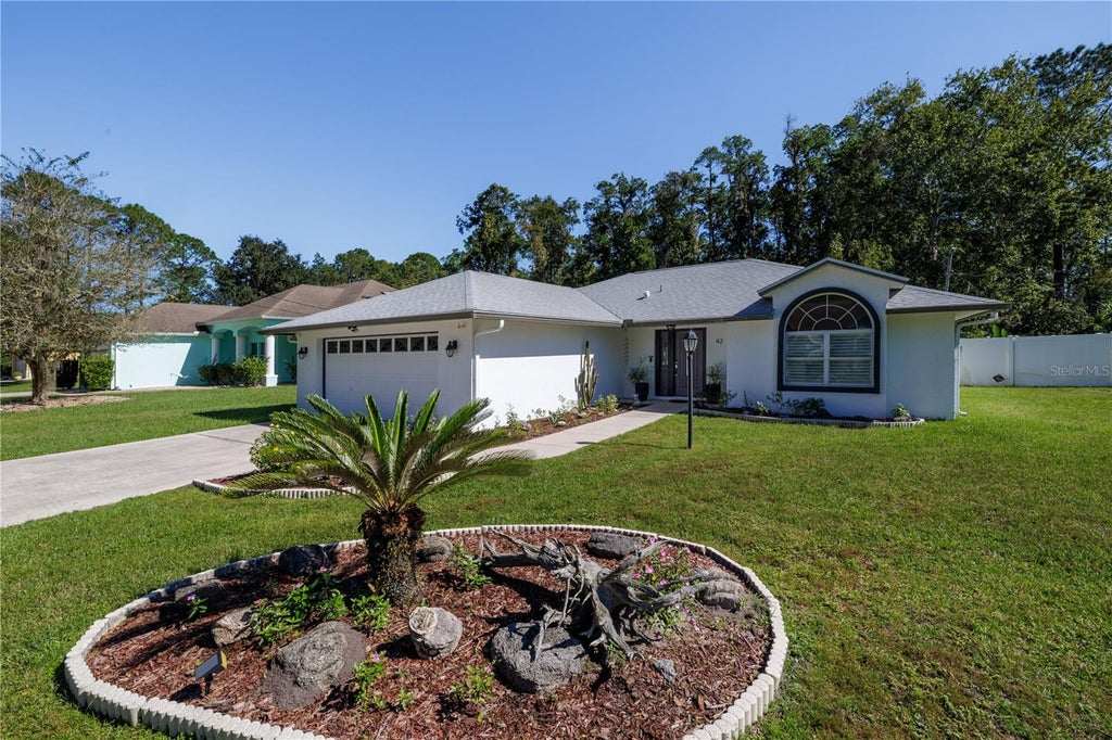 Photo of 42 Zaun Trail, Palm Coast, FL 32164 (MLS # FC322125)