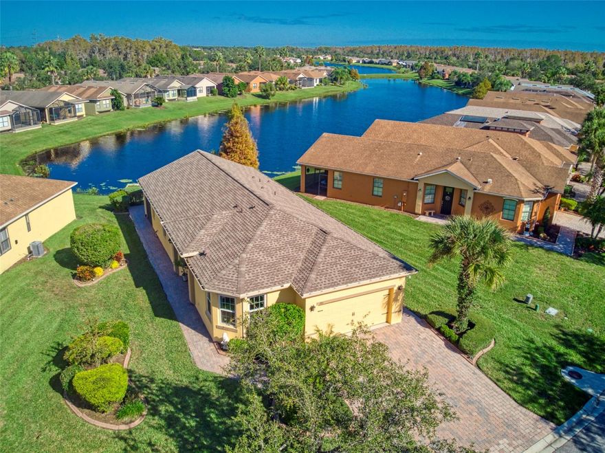 Step into the unparalleled lifestyle of Solivita. Nestled within this vibrant active 55+ community, your new home offers not only a picturesque lakeside setting but also an array of exclusive community features that redefine the meaning of resort-style living. Step inside this meticulously upgraded residence, where modern amenities meet timeless charm. 2007 brought radiant barrier and foam in block walls, ensuring energy efficiency and comfort. Revel in the convenience of a built-in ironing board, a subtle touch that enhances daily living. The 2015 Lennox A/C recall coil replacements and the 2017 kitchen and bath renovations showcase a commitment to both luxury and functionality. Recent upgrades include a new roof, gutters, windows, and blown-in insulation, all completed in 2020. The water heater, a crucial component, was also replaced in 2017. This home's commitment to excellence continues with 2021 additions, featuring new toilets and a Pentair water softener filter. Indulge in the beauty of upgraded bedroom floors in 2022 and revel in the enhanced HVAC system with a distribution box and ductwork increase from 12" to 14" in 2023. Beyond the walls of this splendid abode. Enjoy the proximity to world-famous beaches on the East and West Coast of the Sunshine State,  restaurants, and amusement parks like Disney, Universal, Seaworld and many more! Immerse yourself in the vibrant local culture, and the convenience of having everything you need at your fingertips. Solivita's charm extends beyond your front door, with meticulously landscaped grounds and well-maintained common areas. Enjoy leisurely strolls along manicured walking paths or relax by the pristine lake, taking in the views that surround you. Immerse yourself in the dynamic social scene that Solivita proudly boasts. The community center is a hub of activity, offering a variety of clubs, fitness classes, and events tailored to diverse interests. From tennis courts to golf courses, Solivita provides an active lifestyle for those seeking recreation and fitness opportunities. Cool off in the community's 11 inviting pools, allowing residents to choose from a variety of lovely swimming spots. The heart of the community is a charming village, complete with a couple of restaurants and three golf stores offering shirts, hats, and more for enthusiasts.For the active at heart, Solivita offers expansive pickleball courts, a lap pool, and the luxury of an indoor jacuzzi and sauna. Two generously sized fitness centers cater to various workout preferences, ensuring residents have ample options to stay fit. Families with grandkids will find joy in the community's playground, while holiday activities for the little ones abound, creating cherished memories. Solivita extends its warmth to our four-legged friends, with designated big and small dog parks, making it an exceptionally dog-friendly community. Security and convenience are paramount, with gated entry points providing peace of mind and a sense of exclusivity. The clubhouse is a social epicenter where neighbors become friends, fostering a sense of community that enhances daily life. Additionally, Solivita prioritizes security and convenience with gated entry points, providing residents with peace of mind and a sense of exclusivity.  This is a larger pie shaped lot with larger road frontage than its competitors, it is by far the nicest listing this community has seen in quite some time!