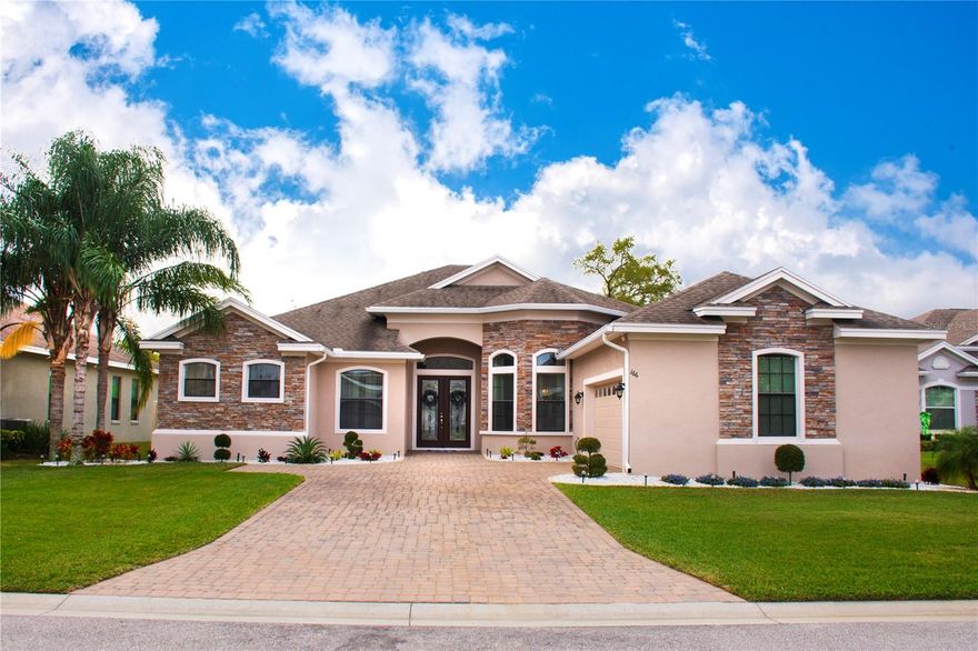 Exclusivity and Luxury in Tuscany Woods. Welcome to the pinnacle of high-end living in Tuscany Woods, one of Auburndale’s most exclusive and sought-after gated communities. This luxury residence redefines elegance, surrounded by breathtaking landscaping and offering the utmost privacy with restricted access. Perfectly situated just moments away from the stunning Lake Ariana, you will enjoy serene scenic views and a tranquil atmosphere in a truly premium location. Design and Impeccable Spaces, From the moment you arrive, the meticulously paved driveway and manicured gardens set the stage for the opulence within. Enter through the double keyless doors to a majestic foyer featuring soaring 12-foot ceilings, an elegant chandelier, and custom plantation shutters that beautifully complement the high-end porcelain tile flooring.
The heart of the home is an expansive "Great Room" designed for seamless entertaining, flowing effortlessly into a chef’s dream kitchen. Featuring granite countertops, 42-inch custom cabinetry, stainless steel appliances, and a generous walk-in pantry, this space is as functional as it is luxurious. Privacy and Versatility: The Primary Suite is a true sanctuary, featuring a specialized blackout track system to ensure total darkness for a restful night’s sleep regardless of the Florida sun. The en-suite bathroom offers a spa-like experience with dual vanities, a luxurious soaking tub, and a separate walk-in shower. The floor plan also includes a versatile flex room (perfect for an office, gym, or playroom), a formal dining room, and a fourth bedroom with a private bath—ideal as a guest or in-law suite. Strategic Location and Peace of Mind. Located in a non-flood zone, this property offers maximum security and peace of mind. Its proximity to the I-4 corridor provides unparalleled connectivity: Southwest: Rapid access to Tampa and its world-class Gulf beaches.
Northeast: Direct connection to Orlando’s world-famous attractions, including Disney World and Universal Studios.