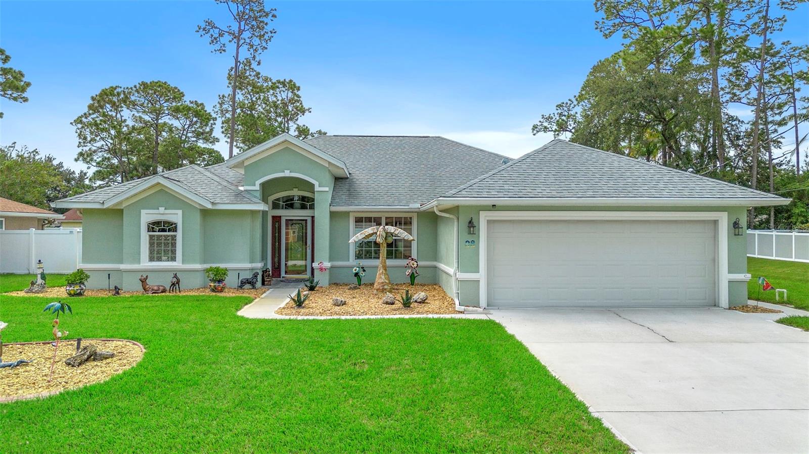 Impeccably maintained and thoughtfully upgraded block construction home is a true showstopper, offering comfort, style and functionality in every detail. Beautifully updated this 3-bedroom 2-bathroom pool home features 1,775 sq. ft. of living space designed for today’s lifestyle. The interior showcases a light and bright open layout with vaulted ceilings, upgraded flooring, modern finishes and abundant natural light that create the quintessential Florida aesthetic. At the heart of the home, the renovated kitchen is a chef’s delight, flowing seamlessly into the dining, living areas featuring quartz countertops, updated stainless-steel appliances, recessed stainless sink, new refrigerator, ample space-saving cabinetry and custom lighting. The spacious bedrooms include a serene primary suite with a private bathroom that includes dual vanities, large soaking tub, walk-in shower &linen closet. Split floor plan with two oversized guest bedrooms, generous closet space and are served by a second full bath. The split floor plan has a pocket door allowing the guest wing to be closed off for added privacy. Both formal dining and a breakfast nook provide versatile spaces ideal for entertaining or everyday living. Stepping outside reveals a private backyard retreat with a screened-in lanai, sparkling pool, newly paved outdoor area, lush green lawn all enclosed by vinyl privacy fencing. Perfect for gatherings or quiet relaxation. A new storage shed adds both convenience, charm and includes a space-saving design with ramped spring-assisted door for easy access. Additional highlights include a roof installed in 2018, impeccable front and back landscaping, a Trane 3-ton HVAC system, custom ceiling fans, stormwater irrigation french drain system to keep the yard dry during tropical months, generator transfer switch and wiring, new seal on the pool pump and glass storm doors at the entry for energy efficiency along with added security. Best part: No HOA or CDD fees. Set on an elevated lot along an established street, this home offers charm, curb appeal and peace of mind while being ideally located near parks, golf courses, walking trails, beaches, hospitals and more! Whether entertaining, relaxing by the pool or enjoying the quiet neighborhood, 88 Woodside Drive is ready to welcome you home.