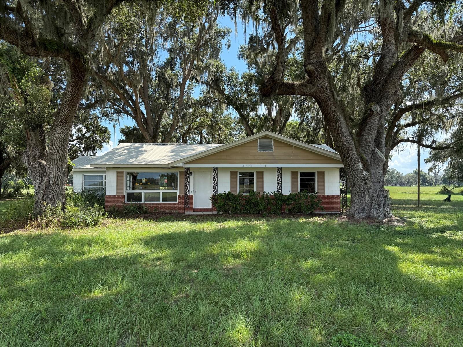 Block house with metal roof set on 5.57 acres in the southern end of Sumter County, this 3-bedroom, 2-bath block home features prime road frontage along State Road 471. Located within the City of Webster, the property is a great investment with potential commercial use. Take advantage of this versatile opportunity in a prime location.