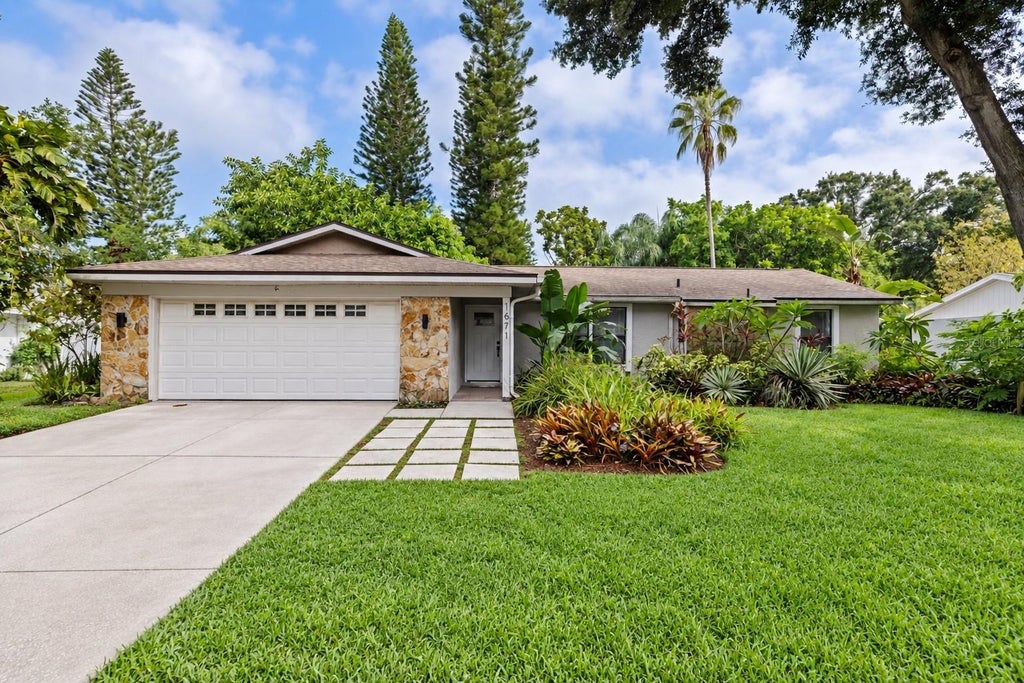 Photo of 1671 Castlewood Lane, Palm Harbor, FL 34683 (MLS # TB8542290)