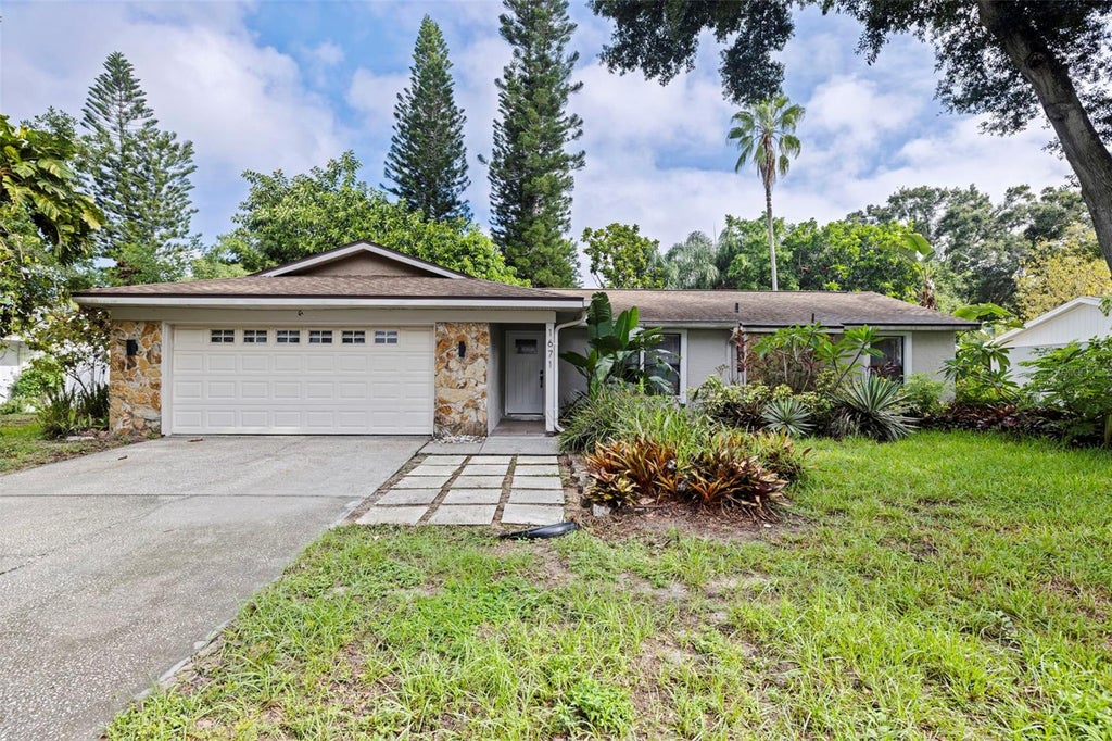 Photo of 1671 Castlewood Lane, Palm Harbor, FL 34683 (MLS # TB8542290)