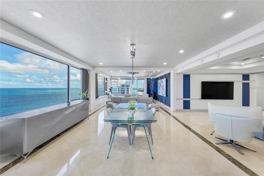 This impeccable turnkey penthouse, located in the heart of Condado Beach, offers the pinnacle of luxurious living by the ocean in San Juan. Approximately 2,700 Sq. Ft., the residence boasts marble floors as well as a well proportioned and integrated living/dining area with a chef-ready kitchen. The kitchen features top-of-the-line luxury appliances, including SubZero refrigerator/wine cooler, Cove dishwasher, Wolf gas stove, and Wolf double oven, accented by an exclusive Lapis lazuli countertop from Chile. The layout showcases a primary bedroom with a massive primary bathroom, a guest bedroom, a separate office, and an additional bathroom, all featuring premium WaterWorks fixtures. Meticulously decorated with high-end furnishings, the home includes a full Sonos sound system, Bluetooth Lutron LED lighting, a 75-inch TV, two central AC units, one inverter AC, and a digital entry lock. The residence also affords a deeded 2-car garage with shelving and is serviced by two elevators. The property is located at Caribe Condominium, which is within close proximity to fine dining, world-class hotels, lively entertainment and schools, such as Saint John's and Robinson. Condado Beach, also known as CoBe, is the island's metropolitan epicenter. Near Isla Verde, Old San Juan and the Miramar Arts District.