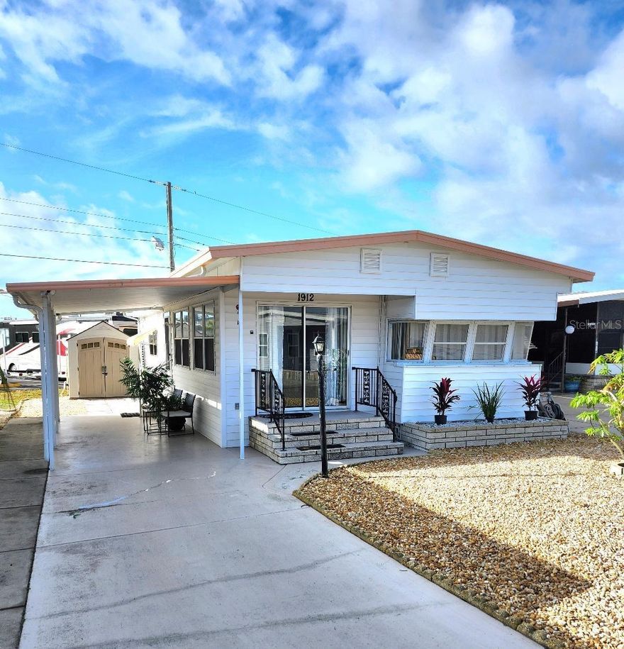 YOUR BUNGALOW in Paradise. Still has a lot of vintage charm, but with many updates to this 2 Bedroom, 1.5 Bath Mobile Home in the highly desired, active 55+ Trailer Estates community. Just steps from the heart of the social scene to access the community pool, recreation buildings, shuffleboard, fitness center, and all the wonderful park amenities. New luxury vinyl floors throughout. Second bedroom has new ensuite half bath. 10'x7' Laundry shed with washer/dryer, plus new 7x7 storage shed. A/C 2017. WDO treated in 2019. You own the land. No lot rent, Park Fees are included into annual real estate taxes. Boaters have direct access to Sarasota Bay from the Marina. Trailer Estates community offers so many options for a great day! Enjoy the large, heated community pool, hot tub, gym and wood shop. The community buzzes with pickleball, shuffleboard, kayaking, horseshoes, bocce, dancing and more. A US Post Office on site. 10 minutes to the SRQ Airport. Convenient to shopping, restaurants, the Arts and everything in Bradenton/Sarasota. Sold furnished. Bring offers!