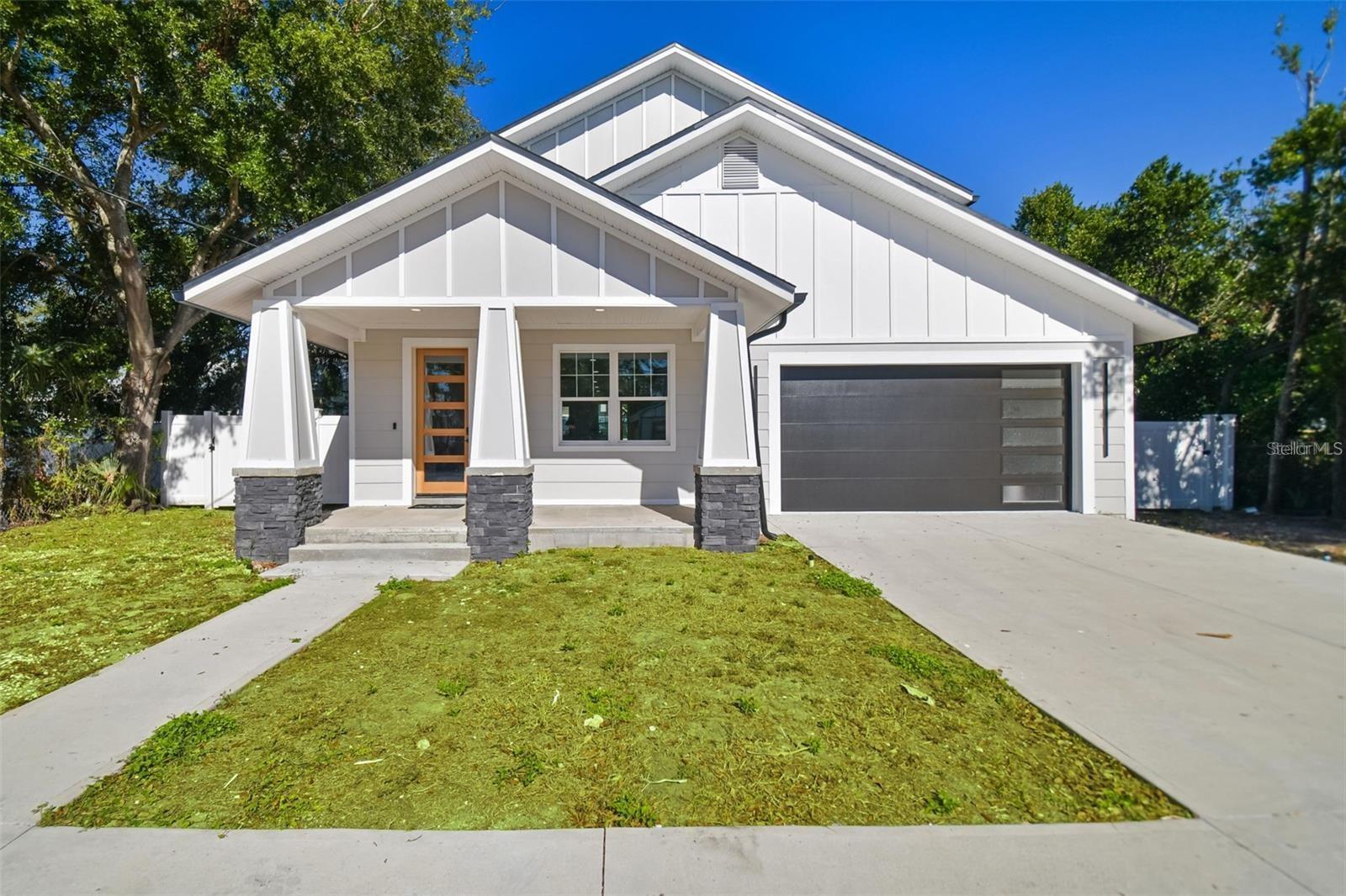 Welcome to a perfect blend of **modern luxury and historic charm**! This brand-new **4-bedroom, 4.5-bath home** offers 2,471 sq. ft. of thoughtfully designed living space just **5 minutes from vibrant Historic Ybor City. Step inside to find a stunning **English Tudor-inspired design** paired with a **neutral, elegant color palette** and **French oak hardwood floors**. The open floor plan is filled with natural light and designed for both everyday living and entertaining. The **chef’s kitchen** is a showstopper with custom ceiling-height cabinetry, high-end quartz countertops, a spacious double waterfall island, stainless-steel appliances, and a GAS-ready setup. From here, enjoy direct access to the fully fenced backyard—perfect for entertaining or al fresco dining. A **first-floor bedroom suite** with walk-in closet and en suite bath provides the perfect retreat for guests or in-laws. Upstairs, three additional bedrooms each feature private en suite bathrooms. The **primary suite** is a sanctuary with a large walk-in closet, dual-sink vanity, quartz countertops, custom cabinetry, and a luxurious walk-in shower. A versatile upstairs loft adds even more living space, ideal for an office, playroom, or media room. Located near Ybor’s rich culture, restaurants, and nightlife, this home also benefits from Tampa’s exciting growth—including the **50-acre Gas Worx project** connecting Ybor to Downtown, Channelside, and Water Street. With **no HOA, no deed restrictions, and short-term rental potential**, the opportunities are endless. Easy access to **I-275 and I-4** ensures quick connectivity across the city. Don’t miss your chance to own a luxury home in one of Tampa’s fastest-growing neighborhoods. Call today for more details and to schedule your private showing!