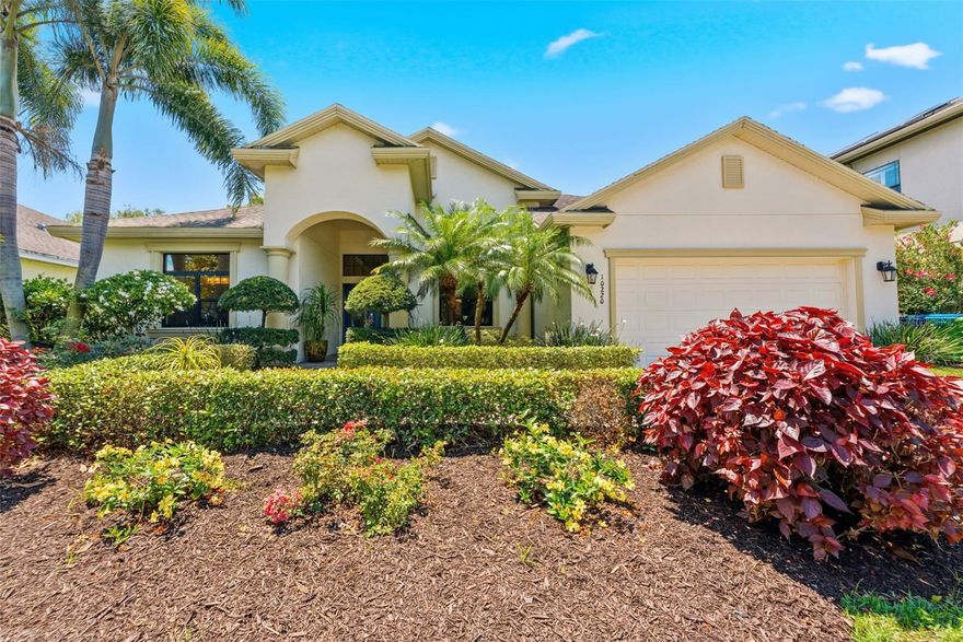 Look no further, welcome to a rare oasis in one of Seminole’s most coveted gated communities on Lake Kersey, where timeless elegance meets elevated waterfront living. This custom built estate captures the essence of luxury with breathtaking lake views, refined design, and a true resort style atmosphere just minutes from the Gulf Beaches. Perfectly designed with both functionality and sophistication in mind, this 4 bedroom, 3 bathroom residence features an expansive open split floor plan enhanced by soaring high and tray ceilings, creating a bright and airy ambiance throughout. As you enter the grand leaded-glass double doors, the layout unfolds effortlessly, offering seamless flow between formal and casual living spaces, all thoughtfully positioned to maximize both comfort and entertainment. The front formal living space is finished with rich hardwood flooring, while ceramic tile runs throughout the main living areas for both style and durability.
Privately situated to the left of the entry, the primary suite serves as a serene retreat, complete with custom built walk in his and her closets and refined finishes throughout. The private primary suite also features dual vanities, a luxurious soaking tub, and a spacious walk in shower, creating a spa inspired retreat. French doors lead directly from the primary suite to the lanai, creating a seamless indoor outdoor connection and a spectacular view of the pool and lake. At the heart of the home, the luxury gourmet kitchen is a true showpiece, featuring custom cabinetry to the ceiling, granite countertops, premium appliances, a built-in wine fridge, and a spacious pantry. The kitchen is conveniently open to the main living areas, including a large rear family room and glassed-in breakfast nook, making it ideal for gatherings with family and friends. A formal living and dining space at the front of the home offers an additional layer of elegance and entertainment flexibility.
Step outside to your own private lanai with an exceptional heated custom pool and spa powered by both gas and electric, featuring unique color-shifting glass tiles, three waterfalls, and a sun shelf. The shaded lanai provides the perfect setting for dining or unwinding while overlooking the tranquil lake. The fully irrigated sprinkler system draws from the lake, maintaining the lush, professionally landscaped grounds filled with magnolia tree, gardenias, roses, and more. Panoramic lake views can be enjoyed from nearly every room. Step out onto the lanai in the morning and enjoy your coffee while taking in the peaceful lake setting, where local wildlife becomes part of your daily backdrop. Additional features include a well appointed laundry room with custom cabinetry, a whole house water filtration system, and Hunter Douglas shades throughout for added comfort and convenience. This home is as efficient as it is luxurious, featuring fully paid-off solar panels for low energy costs and the added benefit of being located outside of a flood zone.  Kersey Lake Estates is ideally located, it is just a 7 minute drive to spectacular Madeira Beach on the Gulf and adjacent to the 38 mile Pinellas Trail. This recreational gem is perfect for biking, jogging, inline skating and access to parks  and residents enjoy their own private entrance to the trail. This property is also moments from premier shopping and dining, it offers the ultimate Florida lifestyle, where elegance, comfort, and convenience meet in perfect harmony.