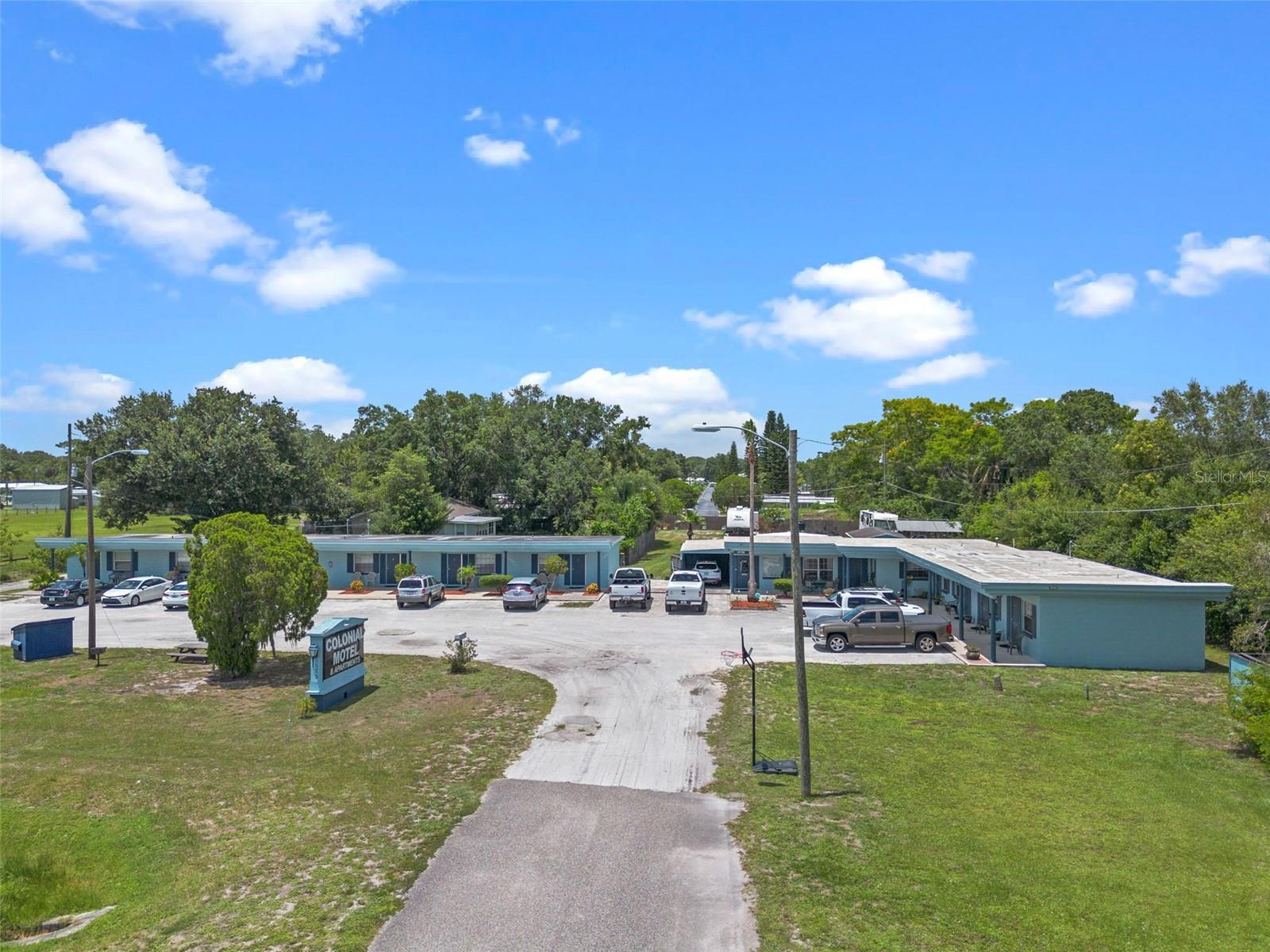 Outstanding Investment Opportunity – Turnkey Motel with Redevelopment Potential!
Now available: a fully operational, income-producing motel property zoned Commercial (C) in the rapidly expanding Saint Cloud market. Located at 5575 E Irlo Bronson Memorial Hwy, this 5,374 SF property sits on a valuable parcel with excellent visibility and frontage on busy US-192.
Currently comprised of 9 rental units, all leased under flexible terms (weekly, biweekly, and monthly), this income-producing property generates approximately $11,937/month or $143,244 annually in gross income, with a Net Operating Income (NOI) of $79,948/year. Building One features a new roof (2021) and a remodeled main living area . Building Two roof was replaced approximately 10+ years ago. Additionally, the site includes a 1,435 sq ft living space with 3 bedrooms and 1.5 baths, which could serve as on-site living quarters for ease of management or be converted into an additional income-producing unit to further enhance returns.
This property offers not only solid cash flow but also significant redevelopment potential—ideal for hospitality, retail, or mixed-use projects. The Commercial zoning (C) allows for a wide range of future uses, making this a strategic acquisition in a growth corridor.
Situated in a high-traffic area near new residential developments, attractions, and major roadways, this is a rare opportunity to secure a versatile asset with strong current income and future upside.