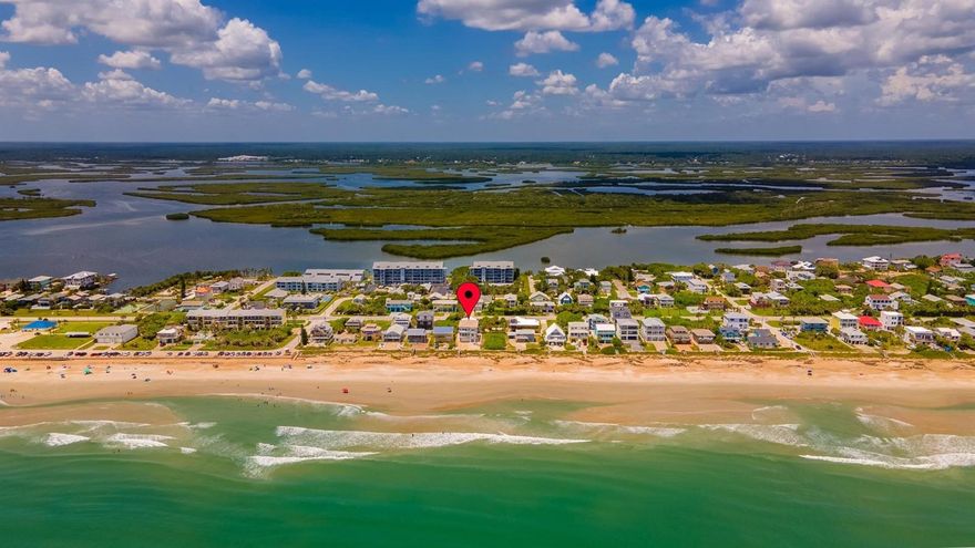Oceanfront 7 bedroom, 4 bath home with room for everyone.  Step out your door and over your private beach walkover to enjoy the surf and sand any time of the day or night.  Rise early to enjoy the fabulous sunrise.  See turtles dig their nests and their babies hatch. Impact glass windows and sliders provide amazing views up and down the beach.  Sweeping staircase leads to main living level open floorplan with spacious rooms, high ceilings, a granite and stainless kitchen with breakfast bar, large great room with plentiful dining and living room seating and balcony.  There are also 2 guest bedrooms and a renovated bath on this level.  Head up the stairs and the wide hallway to enter the private oceanfront master suite with two walk in closets, lounge and exercise space, along with master bath featuring under mount sinks, walk-in shower and jetted tub.  A double set of sliders to take in the views both up and down the beach from this suite and its private balcony.  There are 2 more bedrooms and bath with under mount sinks and walk in shower as well as a laundry room on this level.  The first floor features an in-law suite with separate entrance, 2 additional bedrooms and bath, living room, kitchen and another laundry room.  LED lighting throughout.  Wind rated windows and turtle glass.  Wired for a whole house generator.  Roof 2017.  Three 2019 HVAC units with nest thermostats.  Main water heater is 2015.  Two car garage with 220 electric vehicle charging station plus plenty of additional parking in the deep driveway plus space in the shell yard for the times you invite all your friends to join you for a play date at the beach!  The lifeguard tower is at the end of the street and County park riverfront pier, volley ball, basketball and pickleball courts are just a couple of blocks away. ;Water: City