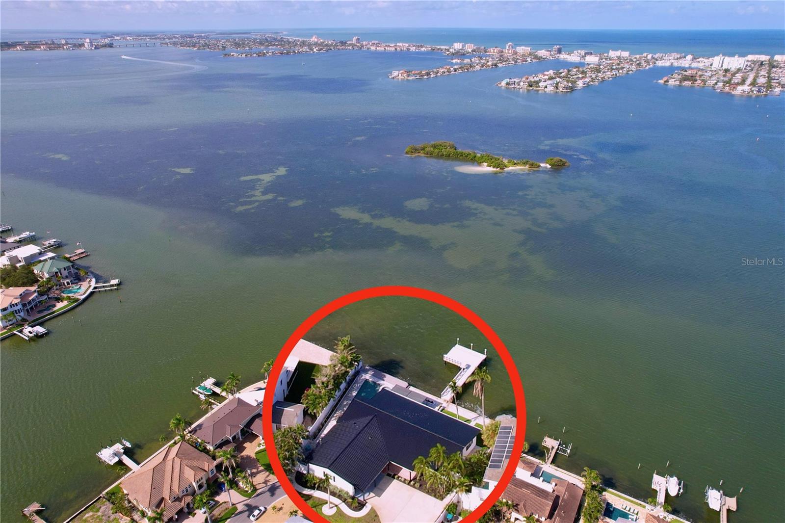 Completely renovated in the last 18 months, this stunning waterfront home in Pasadena Golf Club Estates offers the perfect blend of luxury and location. Situated on a quiet cul-de-sac with an impressive 95 feet of waterfront and expansive open water views, the property features a brand-new dock, new roof and a fully updated interior including new flooring, kitchen, and bathrooms. The open-concept layout is filled with natural light, with a chef’s kitchen that boasts stainless steel appliances and a breakfast nook overlooking the pool and bay. The primary suite offers direct access to the outdoor living area and spectacular water views. Relax by the pool and spa or entertain on the covered patio as you watch the sun set over the water. Located in a jurisdiction that allows short-term rentals and just minutes from St. Pete Beach, Gulfport, and downtown St. Petersburg, this move-in-ready retreat captures the best of Florida living.