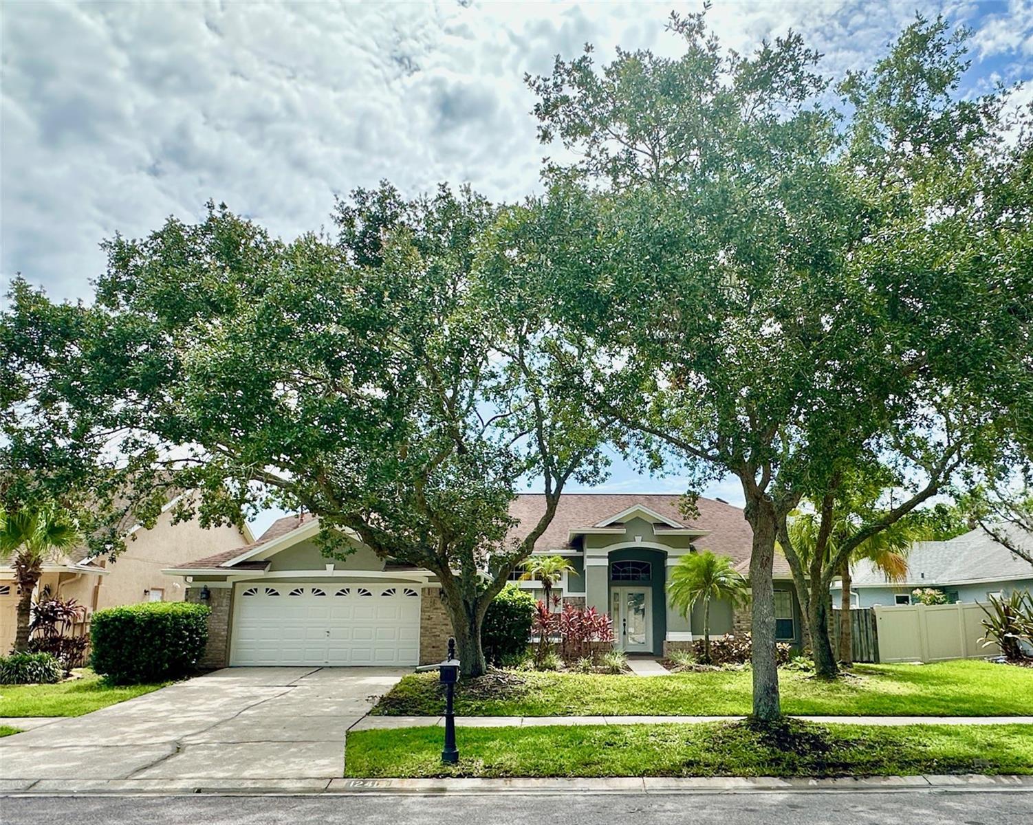 PRICE REDUCED IN WESTCHASE! Don't miss this stunning 4BR/2BA pool home with a split bedroom layout, soaring ceilings, and stylish updates throughout. The chef’s kitchen features rich cherry cabinets, granite countertops, stainless steel appliances, gas range, center island, and a sunny breakfast nook. It opens to a spacious family room with a cozy gas fireplace and sliding doors to your private screened pool—perfect for summer entertaining! The primary suite overlooks the pool and includes a walk-in closet, garden tub, and separate shower. Enjoy BBQs on the covered patio and a fenced backyard with space to play. Updated fixtures and fans give this home a modern touch throughout. Located in Tampa’s sought-after Westchase community—offering golf, 2 community pools, tennis courts, parks and playgrounds. Just minutes to upscale shopping, restaurants, A-rated schools. 20 minutes to Tampa Airport, 30 minutes to Downtown Tampa, and 45 minutes to Gulf Beaches. Just a short walk to Glencliff Park and minutes from golf, pools, tennis courts, top-rated schools, restaurants, and shopping. Easy commute: 20 minutes to Tampa Airport, 30 to Downtown, and 45 to the Gulf beaches. Message us for a private showing today! $150 admin fee due prior to move-in.