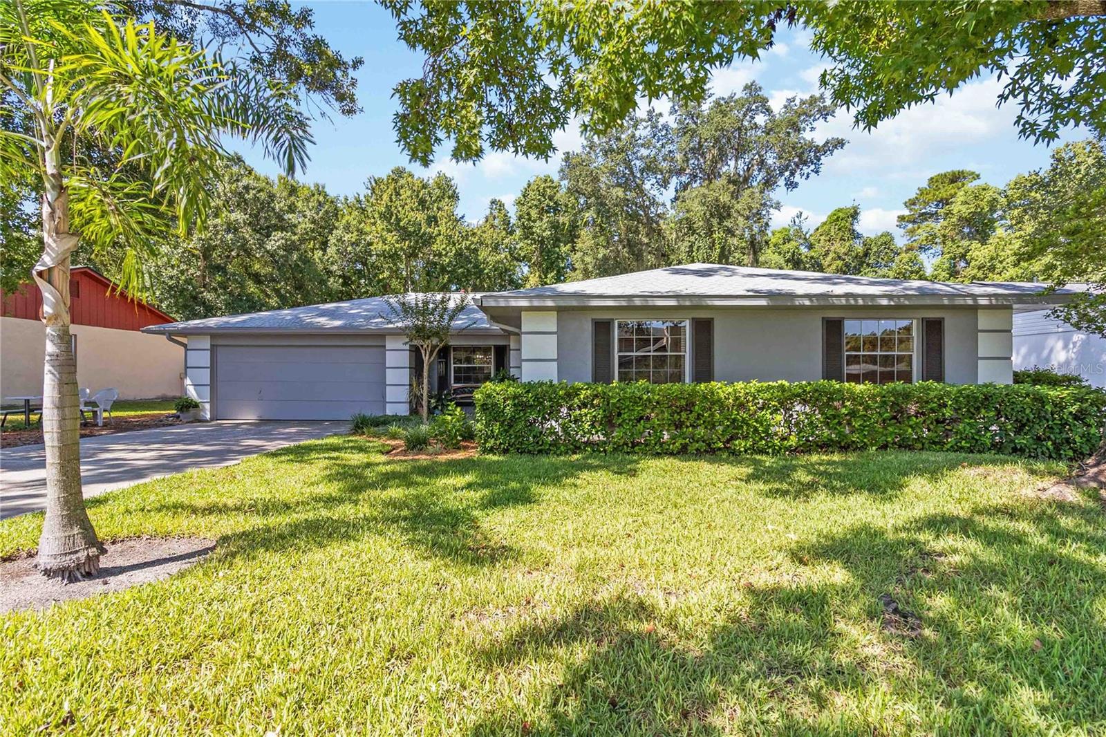 Home Sweet Home. This well-loved Winter Springs property is tucked away on a .27 acre lot that backs up to a wooded greenbelt. There is plenty of backyard to make your own, whether it’s meditating to a symphony of songbirds, relaxing by a firepit under the night sky, getting the gang together for an afternoon of group sports, or lounging on the screen porch that faces it all. Bonus: There’s room for a pool! Inside, this 3 bedroom, 2 bathroom home has multiple gathering spaces for entertaining and daily living. The family room & primary suite both have direct access to the screen-enclosed back porch, and there is a flex space currently used as a home office with an exit door to the backyard. Updates include: 2025: Range, carpet in bedrooms; 2024: A/C Compressor; 2023: Exterior paint; 2018: Water heater; 2016: A/C Air handler; 2014: Roof. Additionally, the irrigation and windows have recently been serviced, a repipe has been completed, and the home has extra insulation to improve energy efficiency. Big Buck Circle is designed as a loop which means no thru traffic and more peaceful living. The Oak Forest neighborhood has a path with swings and benches that connects Oak Forest and Winding Hollow neighborhoods. Winter Springs parks & recreation has large facilities nearby, such as Trotwood Park approximately 1 mile away and Central Winds Park approximately 3 miles. It’s a small town feel with convenience all around.