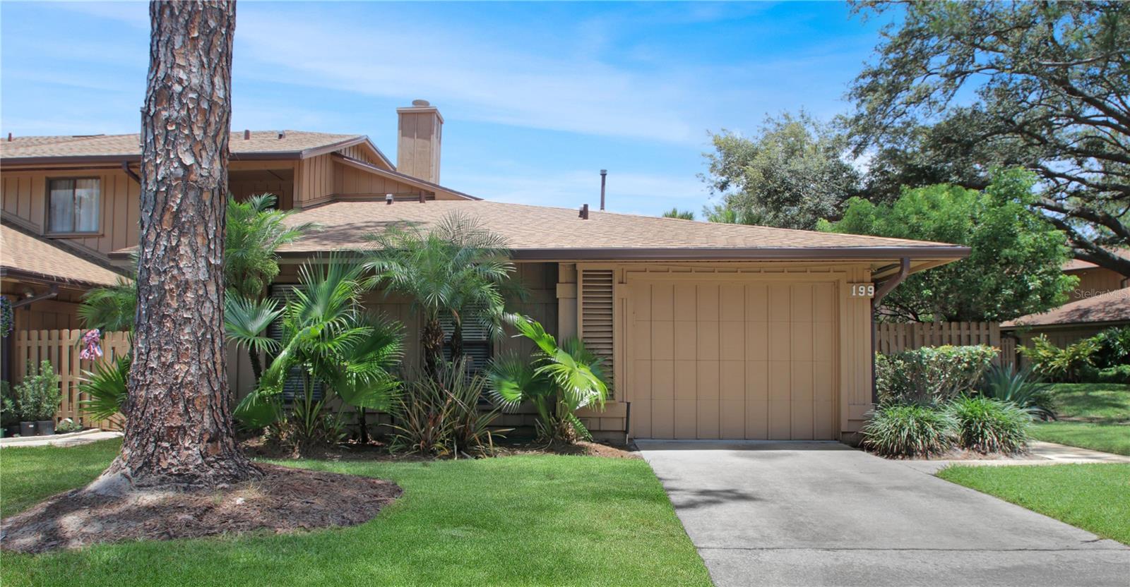 Hidden Gem in Lake Mary! This well-maintained 2-bedroom, 2-bath one-story end unit home in the gated Heron Bay community features a remodeled kitchen with stainless steel appliances, granite countertops, a stylish backsplash, and breakfast bar. Recent upgrades include a new roof (2023), a brand-new water heater (2025), a two-month-old electric panel, and an A/C (2018). The spacious Great Room is highlighted by a wood-burning fireplace and skylights creating natural light. Remodeled master bath adds a touch of luxury. The home also offers a generously sized secondary bedroom and guest bathroom, ample storage throughout and has been re-piped with CPVC. Washer and dryer are also included. Enjoy privacy in the fenced backyard from the screened rear porch, and take advantage of exterior features including screened gutters, an irrigation system, exterior security lighting, and a refinished garage floor. A gated front courtyard with a fountain adds charm and curb appeal. Conveniently located near top-rated schools, shopping, dining, and more - this one is a must-see!