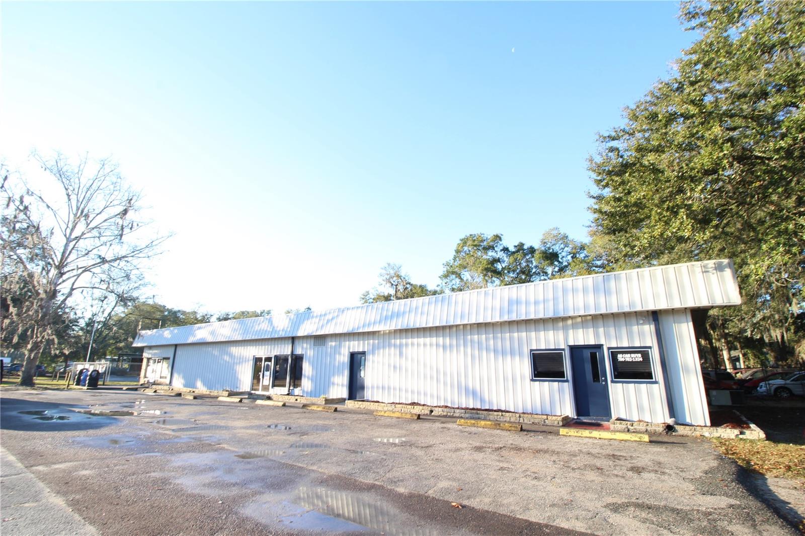 For Lease: Prime Commercial Warehouse Space – 4502 NW 6th Street, Gainesville, FL
High-Visibility Corner Lot | NW 6th Street Frontage | Zoned BA
Unlock the potential of your business with this **1,500 sq. ft. warehouse space** featuring a **10-ft service door**, oversized service bay, and **storefront exposure** on one of Gainesville’s most traveled corridors. Located on a **corner lot**, this unit offers unmatched visibility and accessibility for a wide range of business types.
**New Roof (2024)**
**Fresh Exterior Paint (2024)**
**Brand-New Asphalt Parking Lot (2025)**
**Highway & Building Signage Opportunities** *(at tenant’s expense)*
**Zoned: BA – Business Automotive/Commercial Mixed Use*
Need more room? The owner is open to leasing the **entire 6,000 sq. ft. building** to a single entity. Full building includes:
**5 Service Doors**
**3 Separate Storefronts**, each with private restrooms
**Fenced Rear Lot** – perfect for storage, fleet parking, or secured access
Your next business location starts here. Don’t miss out!