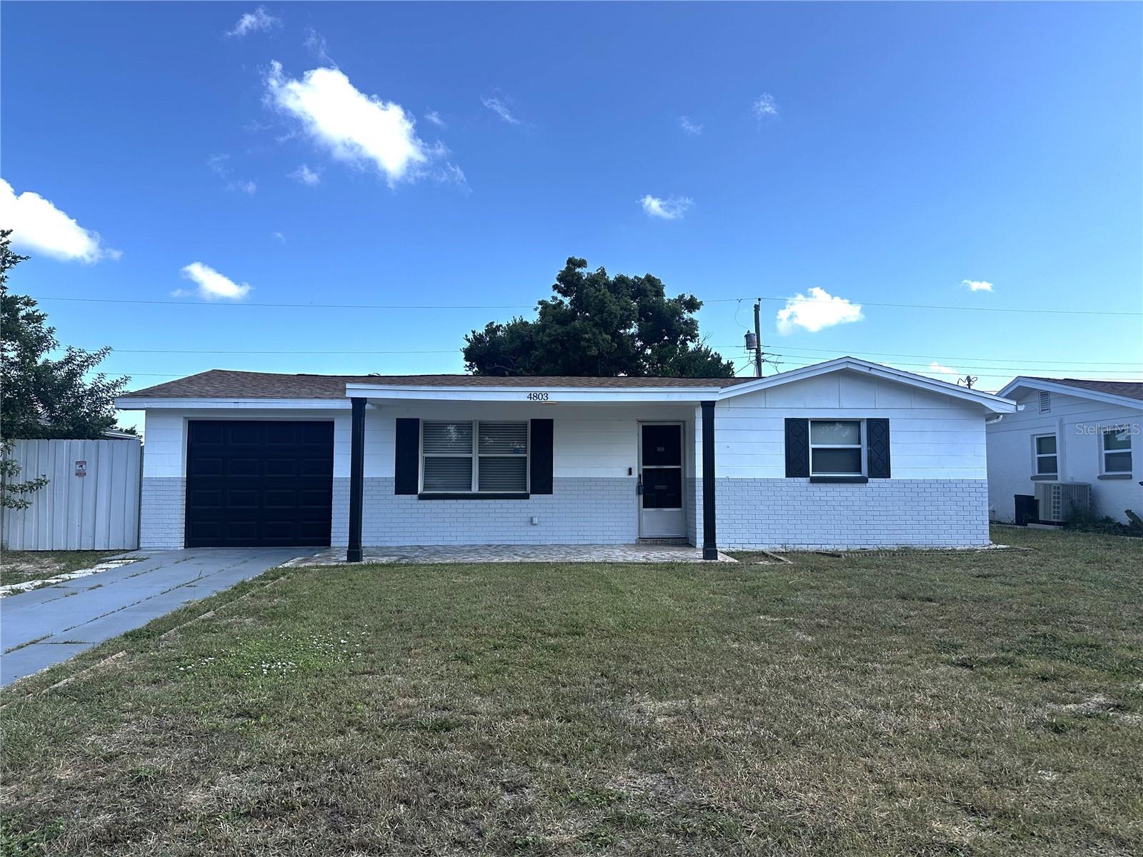 This charming block home features a fenced backyard and a total of 1,402 square feet of living space! NO HOA, NO CDD, NO FLOOD INSURANCE (flood zone X). Key upgrades include a 2018 roof and electrical panel, a 2019 HVAC system, and upgraded PVC piping in 2017. The beautifully updated kitchen has ample storage space, including a pantry conveniently located on the right side. The bedrooms are spacious, and the primary bathroom was recently renovated. Enjoy the ease of maintenance with tiled floors throughout. Located near US 19, a few shopping centers, Tarpon Springs Sponge Docks, and Fred Howard Park. Schedule your showing today!