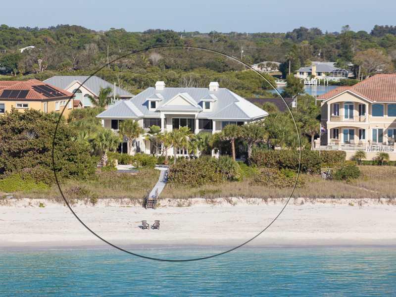Beautifully located on 8-mile Casey Key, perhaps Sarasota's most exclusive barrier island, this newly constructed in 2012-13 gulf-front coastal contemporary home is beautifully appointed. With 4 ensuite bedrooms, plus a gulf side office, plus a room for exercise or office, an elevator, an amazing gulf side pool wrapped by terraces and zen-like gardens filled with unusual plants, this home is ideal for entertaining family & friends graciously. This smart house has systems for lighting & AV; pool & spa; thermostats controlled by local & remote mobile app. The pleasing neutral palette with natural French bone shell tile throughout the main floor and pool area contrasts with the custom hardwood floor on 2nd level. The home is filled with natural light & beautiful white beamed ceilings & has 3 propane fireplaces for ambiance. Wrap yourself in spa-like luxury in the master ensuite with a kitchenette and Miele beverage center. His and Hers closets feature granite counters and Swarovski pulls. Multiple balconies from the master, family room, & office offer stunning garden and gulf views. There is a deeded easement to your own private dock for launching kayaks, and a private lounging deck near the beach dune. Don't miss this stunning opportunity to own new construction on prestigious Casey Key, conveniently located to Venice with a private airport, The Oaks Country Club where associate memberships are available, & minutes to downtown Sarasota.