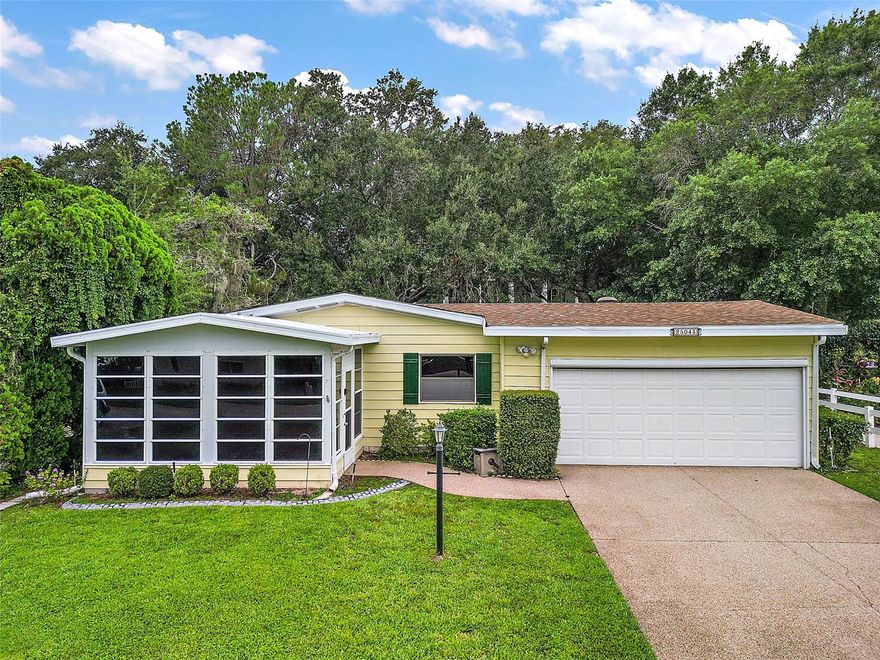 One or more photo(s) has been virtually staged. MOVE-IN READY.. Location, Location, Location.. This 2 bedroom, 2 bathroom Manufactured home located in the desirable 55+ Plantation at Leesburg is ready for its new owners. Conveniently located CLOSE TO THE FRONT GATE, the drive time out of the neighborhood is just a few minutes, while also being just steps away from the club house and several of the amenities that the neighborhood has to offer. There are no rear neighbors as this home provides the rare opportunity to be just steps from the club house! This home has had several upgrades made recently including a FRESH COAT OF PAINT THROUGHOUT THE HOME 2025, NEW ROOF OCTOBER 2023, NEW HVAC 2022, NEW WATER HEATER 2022, NEW KITCHEN APPLIANCES 2024 and NEW LUXURY VINYL PLANK FLOORING installed 2024 throughout the main living area of the home. Driving up to the home you will be pleased by the long driveway, and well maintained yard. Entering the property, you are greeted by the 10X14 Florida Room perfect for a sitting room, TV room, or the perfect space for all of your indoor plants. The living/ dining room combination provides plenty of space for family gatherings and has natural sunlight beaming in throughout the day. The dining room features a built-in with lighting to display your favorite trinkets and formal dining pieces. The kitchen features brand new appliances, cream colored cabinetry, and an eat-in space to enjoy your meals. The laundry room is located in the hallway off the kitchen, which leads to the garage featuring an electronic remote controlled privacy screen, overhead storage, a storage closet, a pegboard workshop area, room to park your car/ golf cart, and a door which leads to the enormous back patio ready for your back yard dreams to come true. The back patio is perfect for potted plants, a grilling area, and some outdoor furniture so you enjoy the back yard year round. Walking back into the home down the main hallway you will find the owners suite with a walk in closet, en-suite bathroom with a garden tub, and built-ins for all of your storage needs. The guest bedroom is large enough to double as a hobby room, man cave, or anything that your heart desires, and has a large closet for additional storage, if needed. Remember you are just STEPS from the club house, a pool, and several outdoor sports - it doesn't get better than this! The Plantation at Leesburg is an active 55+ community with several amenities including 3 club houses, three swimming pools, two 18-hole golf courses, lighted tennis courts, world class fitness centers, men's & women's wet and dry saunas in the fitness center, pickle ball, bocce ball, shuffleboard, softball/ baseball field, horseshoes, beautiful lakes, great fishing, drama clubs, computer clubs, broadway caliber shows, ballroom dancing, billiards, large swimming pools, crafts, full-time activity directors, and Plantation Oaks Restaurant. Call for your private showing today!