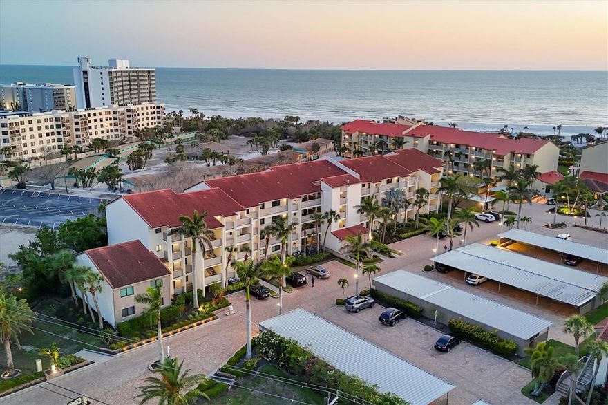 Experience coastal living at its finest in residence #300 at Siesta Dunes, ideally on renowned Siesta Key Beach. This meticulously remodeled two-bedroom, two-bath condominium offers 1,150 square feet of luxurious living space on the third floor, providing a tranquil ambiance and a sense of escape. Crown molding accents the professionally decorated interior, creating a sophisticated atmosphere. Sold turnkey furnished, this residence offers a seamless transition into upscale beachside living. Go inside to find chiseled travertine tile flooring throughout, adding natural coastal charm. The chef’s kitchen is equipped with granite countertops, stainless steel appliances and maple cabinetry, blending style and functionality. French glass doors open to a private lanai terrace surrounded by lush garden views. The lanai is enclosed with hurricane-resistant sliders, while the primary suite features hurricane-resistant windows for added peace of mind. The primary suite also includes a custom-organized walk-in closet, enhancing storage and convenience. A convenient stackable washer and dryer are in the unit. Additional features include an assigned covered carport, a private storage closet, ample guest parking and access to the building elevator. Siesta Dunes is a gated community offering a wealth of resort-style amenities, including a heated pool and spa for year-round enjoyment, a beachside deck, pavilion, clubhouse, and tennis and pickleball courts. Utilizing the on-site property management company makes renting the property easy and carefree. With excellent rental potential, two-week minimum stays from January 15 through the end of April and one-week minimums the rest of the year, this condominium is a compelling investment opportunity as well as a personal retreat. Siesta Dunes is in a good location, making it easy to explore Sarasota’s world-class dining, shopping and entertainment. Siesta Key Beach is just a short distance away, recently named the No. 1 beach in America by TripAdvisor. Renowned for its powdery white sand, clear waters and stunning sunsets, it’s no wonder Siesta Beach is considered the pinnacle of coastal living. Whether you seek a full-time residence, a luxurious vacation retreat or a high-value investment, this extraordinary property exemplifies the best of gulf-front living.