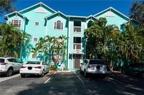 Absolutely stunning 2BR/2BA top floor condominium in Mallory Square. Located in the heart of South Tampa just walking distance to some of Tampa's best restaurants and nightlife, and zoned within the highly rated Plant High School district! This TOP FLOOR unit has high vaulted ceilings and tall windows throughout that let in lots of natural light and really opens up the home and makes it feel warm and spacious. This cute and charming condo has laminate flooring throughout all the common areas and both bedrooms, with tile in the kitchen and baths. The kitchen is light and bright with all white cabinets and appliances, and a breakfast bar. The master bedroom is good sized with a large closet, and the en-suite bath is upgraded with a granite vanity countertop and a beautiful travertine style tile walk-in shower. Washer & dryer in unit. The entire home is light bright and inviting. Truly a gorgeous home.
