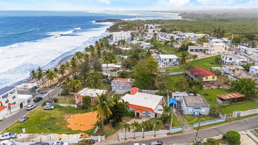 Wake up and walk to the beach. This charming 2BD/2BA Spanish colonial home sits just steps from the Atlantic in Dorado's sought-after Barrio Mameyal — one of Puerto Rico's most beloved beachside neighborhoods. Grab your board and hit the waves in minutes, as the area is known for some of Puerto Rico's best surfing spots right on the North Coast. Spend your mornings riding waves and your evenings unwinding on a stunning covered arcade terrace with sweeping ocean breezes. Set on an expansive 833 m² lot with lush tropical landscaping, this is more than a home — it's a surfer's paradise. Whether you're looking for a primary residence, vacation retreat, or investment property, opportunities this close to the water in Dorado don't come around often. Surf, sun, and sand — every single day.

Appliances Included: Microwave, Linear Water Heater, 2 Split Unit Air Conditioners