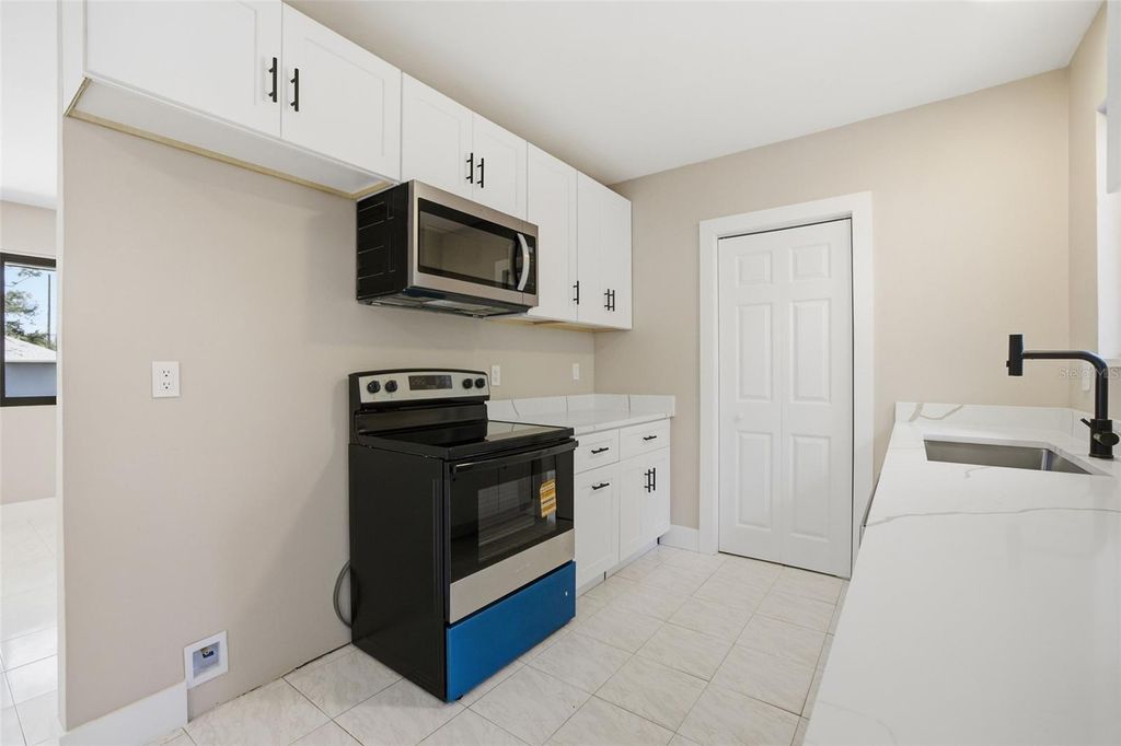 Photo of 400 Kenova Street, Port Charlotte, FL 33954 (MLS # C7522191)