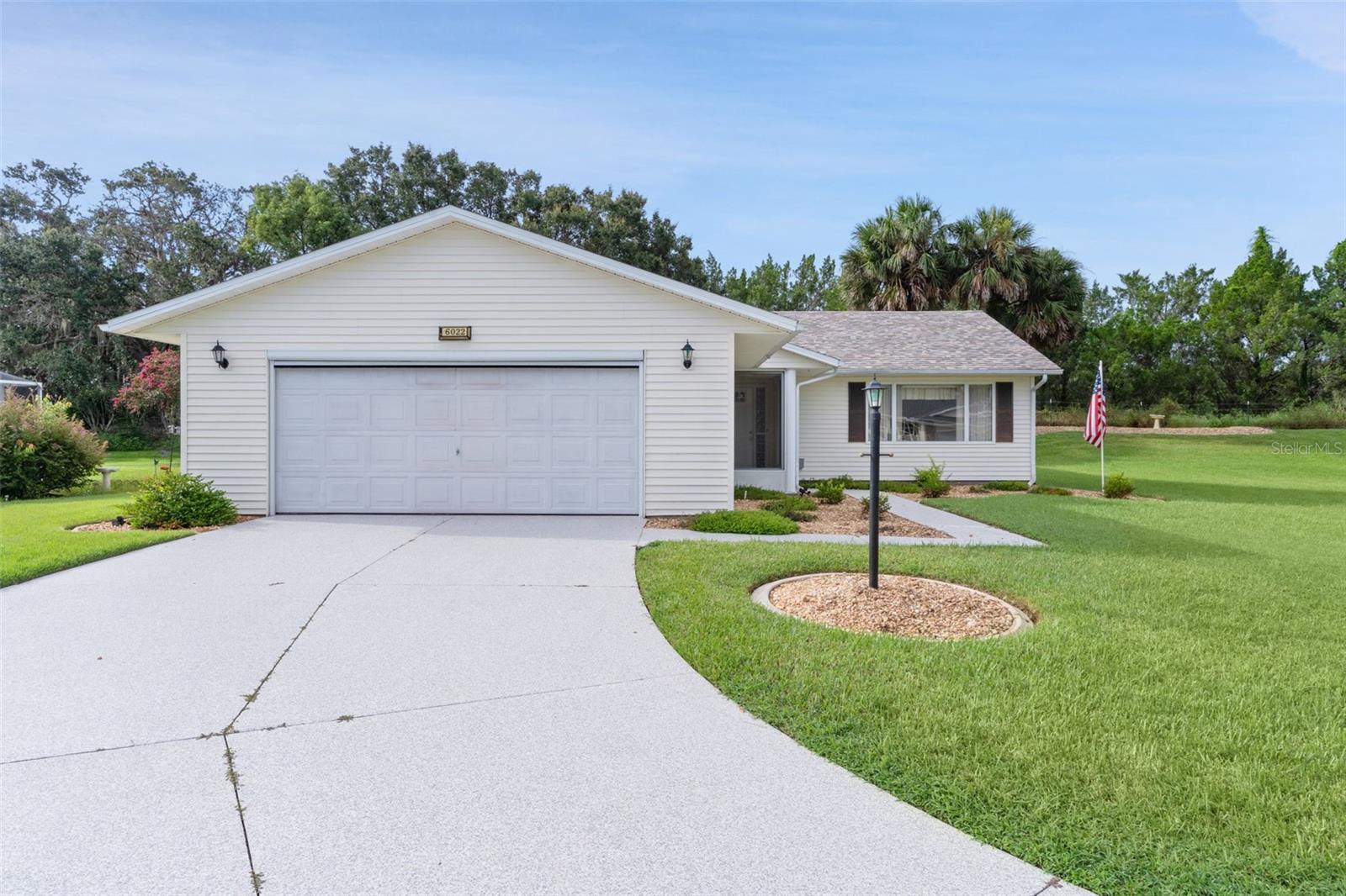 Welcome to HIGHLAND LAKES a Gated 55+ Community! LOCATION!! Don’t miss out this 3 bedroom, 2 bathrooms, 2 car-garage home that is PRIVATE with NO REAR or RIGHT-SIDE NEIGHBORS!! Located on a Cul-de-sac, this is a .33 OVERSIZED LOT with ROOM TO GROW —add a Pool, Birdcage, or create your dream Outdoor Living Space. The Enclosed Lanai is 22x16 with AC with Views of the Backyard and ADDITIONAL 352 sq ft of Living Space. ROOF 2023, HVAC 2024. At the entrance you are greeted with a lovely Screened Porch that can be enclosed with vinyl windows that are in the garage. Stepping inside to a bright Living/Dining combo with Vaulted Ceilings, a large Front Window, and an Octagon Window that fills the home with Natural Light. LAMINATE & TILE FLOORS throughout the home. The Kitchen offers plenty of cabinets, a PANTRY CLOSET, EAT-IN KITCHEN, and room for a coffee bar. The private Primary Suite features an updated EN-SUITE BATHROOM that includes Newer Shower with sleek GLASS SHOWER, Vanity, Medicine Cabinets, and direct access to the Lanai—perfect for relaxing or entertaining. Two guest bedrooms with built-in closets share a full bathroom equipped with Tub/Shower combo and Hand Grips for ease of access and large vanity. The Laundry Room has a Newer Washer and Gas Dryer. The oversized 22x26 garage provides extra STORAGE, a WASH TUB, ATTIC, an additional Refrigerator, and an AUTOMATIC GARAGE SCREEN DOOR. Also, the OVERSIZED DRIVEWAY for room for your guest to park. Highland Lakes is a gated 55+ community situated in Central Florida just south of Leesburg & offers residents the following amenities: Recreational Clubhouse with two swimming pools; indoor (heated) & outdoor, a softball field, an indoor arena with a stage for community events, kitchen, billiard/ping pong rm., 6 tennis courts (2 courts are lighted & 4 courts have a cushion surface), 8 lighted shuffle board courts, bocce ball courts, pickleball, 7 horseshoe pits, covered picnic pavilion with picnic tables & grills to barbeque, library, meeting/card room, exercise room/fitness, craft room, golf driving range, RV/boat storage is also included & has 260 RV spaces on a secured lot (fenced & lockable), a Craftsmen building/woodworking shop (homeowners can join the club for only $12 annually and use any/all tools available), there's also a Nature Trail within the community & seven lakes scattered throughout Highland Lakes; 4 are used by residents for catch & release (fishing)! Don’t wait too long, this home is priced to sell. Home is Ready for you to move in and make it your own!