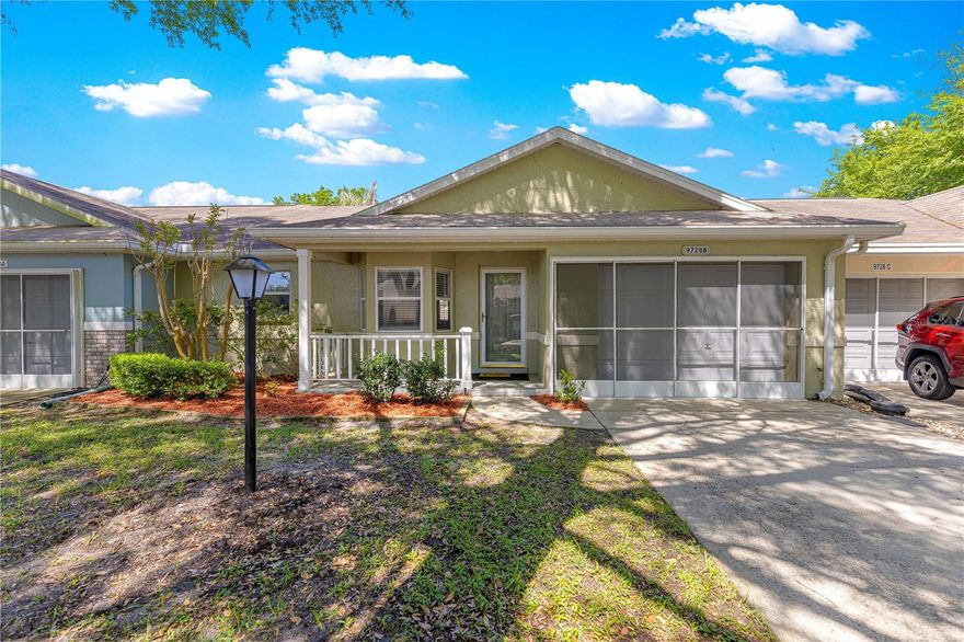 Welcome to easy, carefree living in this popular Olympia Model villa, ideally located on a quiet, tree-lined street in the highly desirable 55+ gated golf community of On Top of the World in SW Ocala. A charming front porch sets the tone—perfect for morning coffee and connecting with neighbors. Inside the beautiful lead glass door, you’ll appreciate the vaulted ceilings and light, bright layout that creates an open, comfortable feel throughout. HVAC 2020 & ROOF 2011. The kitchen is conveniently located just off the entry and features upgraded appliances, a window over the sink for natural light, and a cozy eat-in space at the front of the home—ideal for casual meals. Designed with privacy in mind, the split-bedroom floor plan separates the two bedrooms and baths. The primary suite includes a walk-in closet and an en suite bath with a step-in shower—no tub to worry about—making daily routines easier and more accessible. The guest bedroom and bath are tucked away on the opposite side, offering comfort and privacy for visitors. The spacious great room is perfect for relaxing or entertaining, while the covered patio provides a peaceful outdoor retreat with minimal upkeep—just enough space to enjoy Florida’s beautiful weather without the hassle of extensive maintenance. The 1-car garage includes the laundry area for added convenience. Living here means more than just a home—it’s a lifestyle. Enjoy golf, pools, fitness centers, clubs, classes, and endless social opportunities, all just a short golf cart ride away. Motivated sellers—bring your offer and start enjoying the active adult lifestyle you’ve been looking for! The monthly HOA fee includes Basic Spectrum Cable, roof repair, exterior painting every seven years, exterior maintenance and insurance, landscaping, trash & recycling, 24/7 monitored gates and what seems like endless amenities; FOUR pools (3 outside & 1 inside), two state of the art fitness centers, pickleball (uncovered & covered), billiards, archery range, corn hole, bocce ball, tennis, shuffleboard, horse shoes, remote control flying field and race cars, 175+ clubs, woodworking shop (extra fee), library, and much, much more! A golf cart community with access to several shopping centers. Centrally located 20 minutes from the World Equestrian Center, easy drive to 4 cruise ports and/or airports, and within a close proximity to entertainment complexes in Orlando. This home is located on leased land, 99-year land lease from the year the villa was constructed. Community requires 20% down with all mortgages.