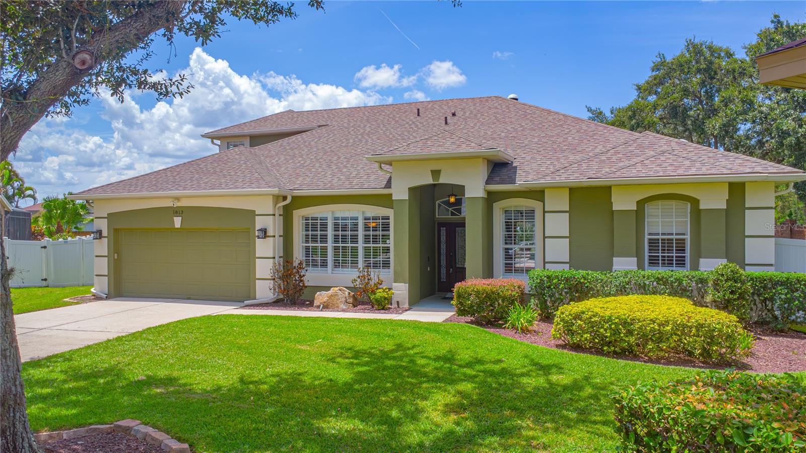 Welcome to this beautifully maintained and thoughtfully upgraded home, situated on one of the largest lots in the neighborhood. Designed with a highly functional three-way split floor plan, this residence offers exceptional privacy and flexibility. A separate back bedroom and bath can be closed off for guest use or multi-generational living and includes direct access to the pool, along with a fully accessible roll-in shower equipped with safety bars.
Natural light fills the home thanks to four strategically placed solar tubes, including an adjustable one in the family room. Plantation shutters add timeless elegance throughout, and custom closet systems in most closets provide abundant storage, including a spacious walk-in closet tucked under the stairs in one of the secondary bedrooms.
The gourmet kitchen is a standout feature, boasting more than $70,000 in upgrades. It includes a gas stove, top-of-the-line stainless steel appliances, 42-inch upper cabinets with glass display accents, quartz countertops and backsplash, an oversized island with seating for three to four, a wine fridge, upgraded drawer-style microwave, and a butler’s pantry. Additional conveniences include a window seat with built-in storage, pull-out shelving, slide-out pantry drawers, and a pot filler above the stove.
The oversized primary suite offers peaceful views of the pool and includes access to an adjacent den or nursery, which could also function as a sixth bedroom. The renovated primary bathroom is complete with custom cabinetry, vessel sinks, ample lighting, and dual walk-in closets with built-in organizers.
All main living areas—including the family room, formal living room, and primary suite—overlook the expansive screened-in pool area, which features a spacious covered lanai and open-air paver decking, perfect for entertaining or relaxing. The upstairs bonus room provides a versatile space for a media room, home office, or additional bedroom. A well-equipped laundry room adds convenience with generous storage.
Additional features include ceiling fans throughout, a whole-house generator, and a 500-gallon propane tank that fuels both the generator and gas stove. This home blends smart design with luxurious upgrades, offering an exceptional lifestyle in a prime location.