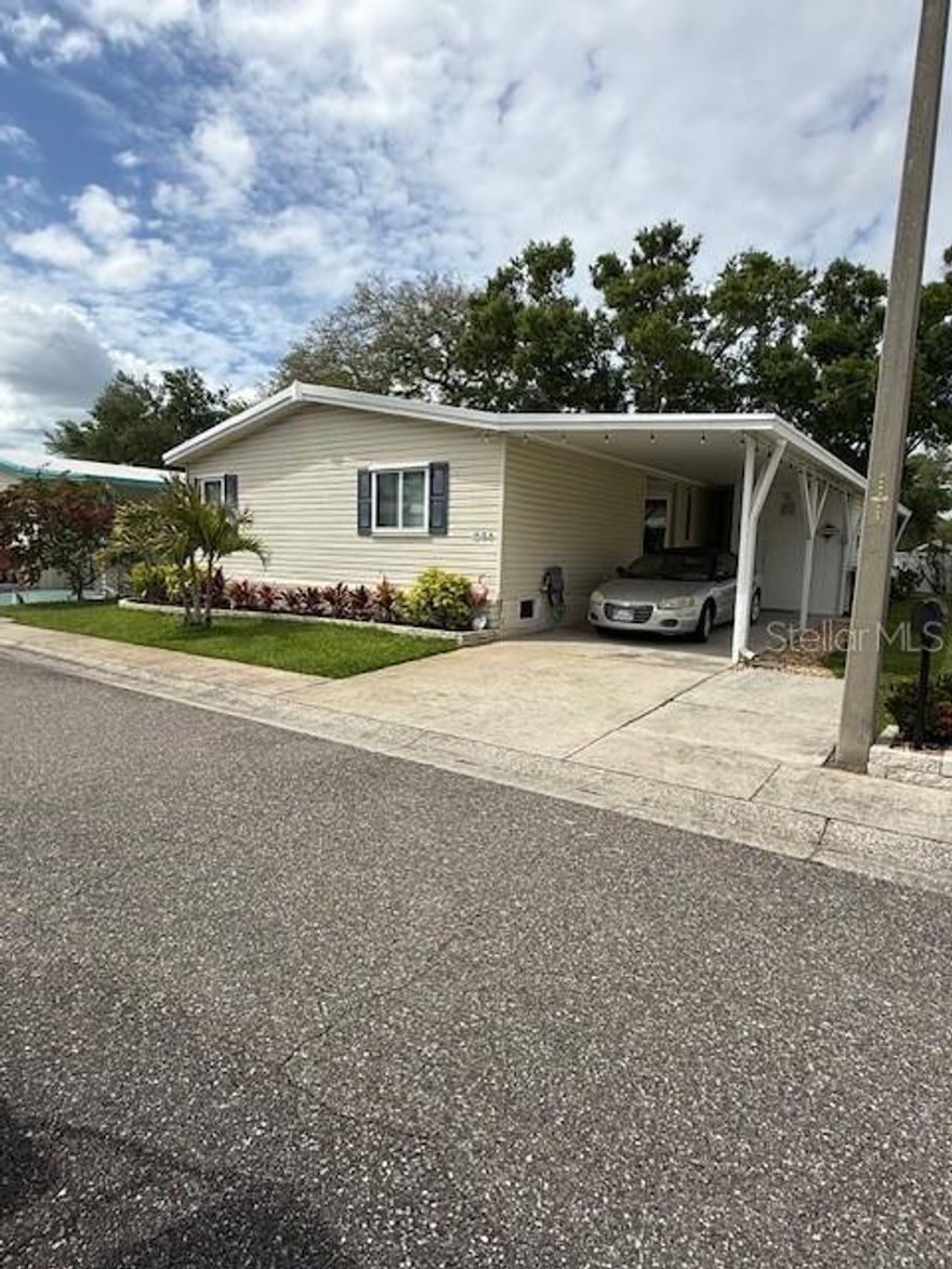 3 BEDROOM 2 BATH PET FRIENDLY PERIMETER PROPERTY FURNISHED This home is located in Paradise Island Coop located in Largo.  Only 13 miles away from the Gulf of Mexico. This home is by far one of the best Move-In Ready properties currently available in this park.  Let’s get started. 2018- All new Thermopane windows throughout-New Shingled roof. 2020 new Washer n Dryer. 2022 Induction Stainless Steel Range/oven with pots and pans-Master bath Vanity w double sinks-New High elongated toilets-home re-piped with PEX 2023 Florida room raised floor and remodeled with Thermopane Windows-Insulated Roof in Florida room-new AC w Heat in Florida room-Patio Pavers installed in backyard-Front Storm Door-New 7’x7’ Shed. 2024 New Master bath Shower w glass doors & Rainfall Shower Head-External home Trim Painted-New Formica Countertops-Under belly of home Serviced and Checked-New Deep Kitchen Sink. 2025 New AC Unit installed. Misc. Upgrades Cabinets painted, interior painted and most of the ceilings-14 CU. FT. Stainless Steel Frig- Faux Wood Blinds Throughout-Newer Flooring and there will be a list of the items that will be available when viewing this property.  This home is a 26 by 56 ft. home with a raised Florida room. The large Master Bedroom comes with wall-to-wall closets and a connecting master bath. The master bath has a 2-sink vanity, linen cabinets, and there is a beautiful walk-in shower. The 2 guest bedrooms and Guest bath are at the front of the home with each have large windows.  The home opens into the open concept living and dining room floor plan. Off the dining room is the Galley Kitchen with a bright and sunny breakfast nook and a Laundry Closet with the newer Washer n Dryer. The central AC unit is top-notch and just installed in 2025 which will keep you nice and cool on those hot summer days.  
Off to the right of the breakfast nook, is a spacious and newly raised glassed in Florida room.  Great space for enjoying it as an office, casual living or as a TV room. This is a perimeter property so the backyard could be great space for outdoor gardening, a BBQ grill or a space for your 4-legged baby. As a Share owner you are entitled to the following amenities: * UNLIMITED WATER & SEWER * 2 TIMES WEEKLY GARBAGE PICKUP * MAIL DELIVERY TO YOUR MAILBOX IN FRONT OF HOME * YARD CARE (MOWING, EDGING) 
SPECTRUM CABLE & WIFI SERVICE The monthly fees are $461.40 Other Park amenities includes: Large heated pool and hot tub that is available 7 days a week. There is also a plethora of clubs that you can join if you so desire. This is a well-established and maintained park. Here is your opportunity to own this well-maintained Share property. ** The information provided herein is believed to be accurate, but is not guaranteed**